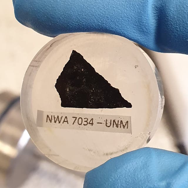 <p>A sample of the Martian meteorite known as ‘Black Beauty’ is seen in this Curtin University photo. Black Beauty’s zircon grain was found to have ‘fingerprints’ of water-rich fluids </p>