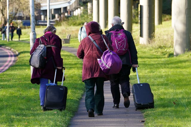 Passengers at Gatwick airport near Crawley, West Sussex (Gareth Fuller/PA)