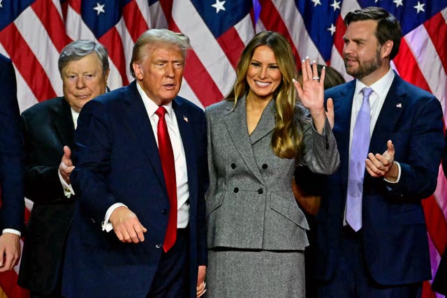 <p>Former US President and Republican presidential candidate Donald Trump gestures at supporters after speaking as he holds hands with former US First Lady Melania Trump during an election night event at the West Palm Beach Convention Center in West Palm Beach, Florida, early on November 6, 2024</p>