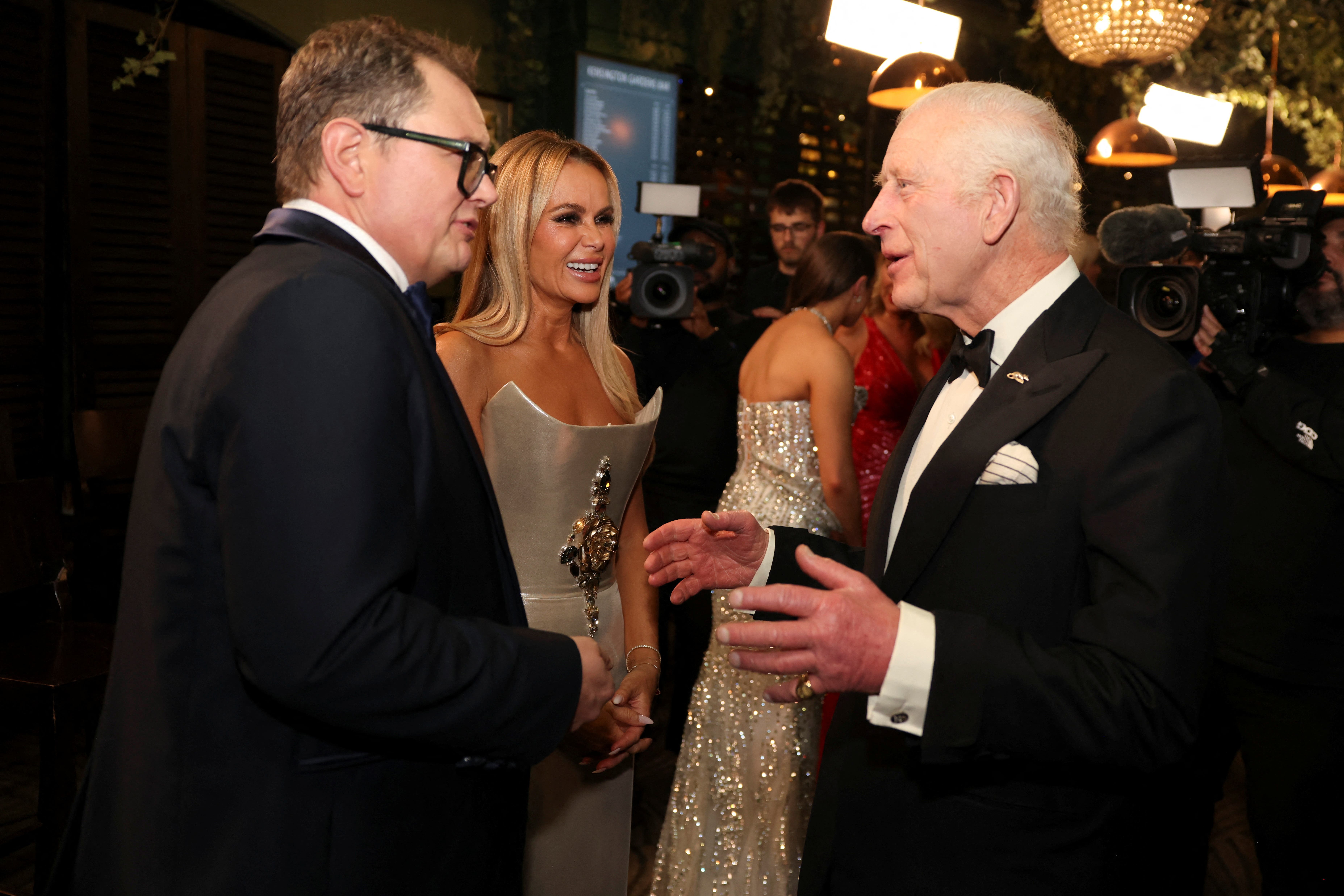 The King meets Alan Carr after the Royal Variety Performance at the Royal Albert Hall, London. (Hollie Adams/PA)