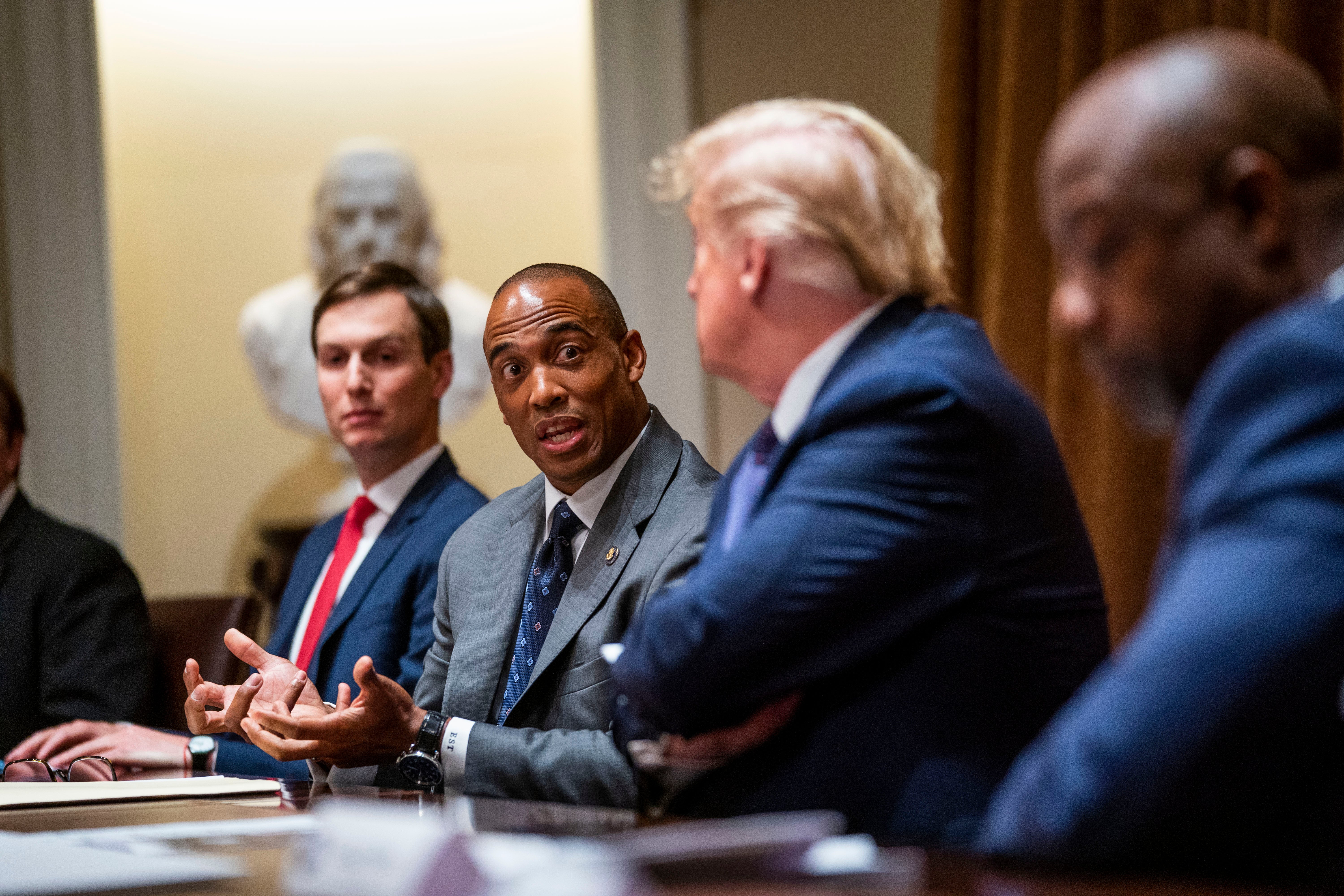 Scott Turner speaks as U.S. President Donald Trump and senior adviser Jared Kushner listen during a meeting in the Cabinet Room of the White House May 18, 2020 in Washington, DC