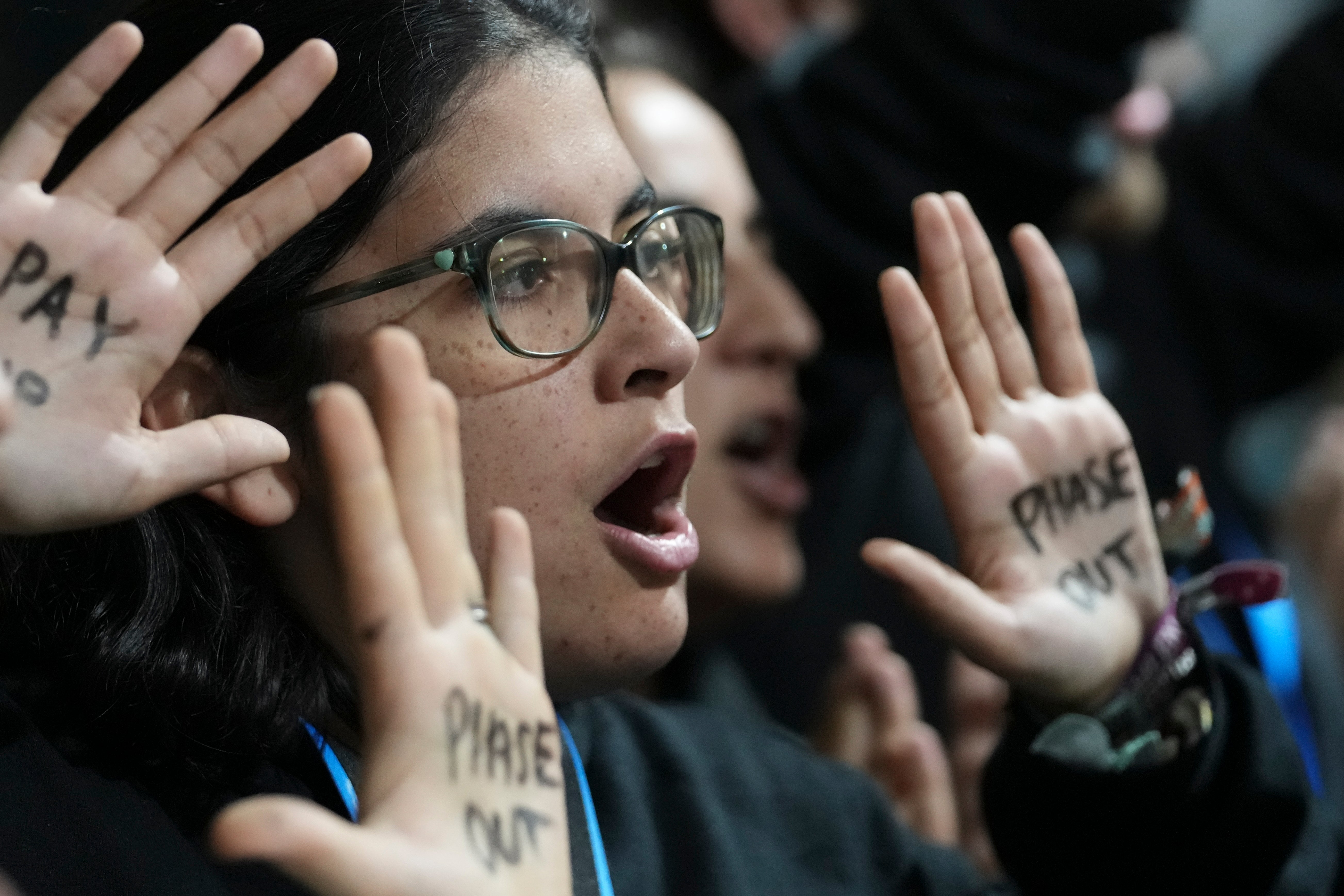 An activist participates in a protest at the UN summit in Baku, Azerbaijan