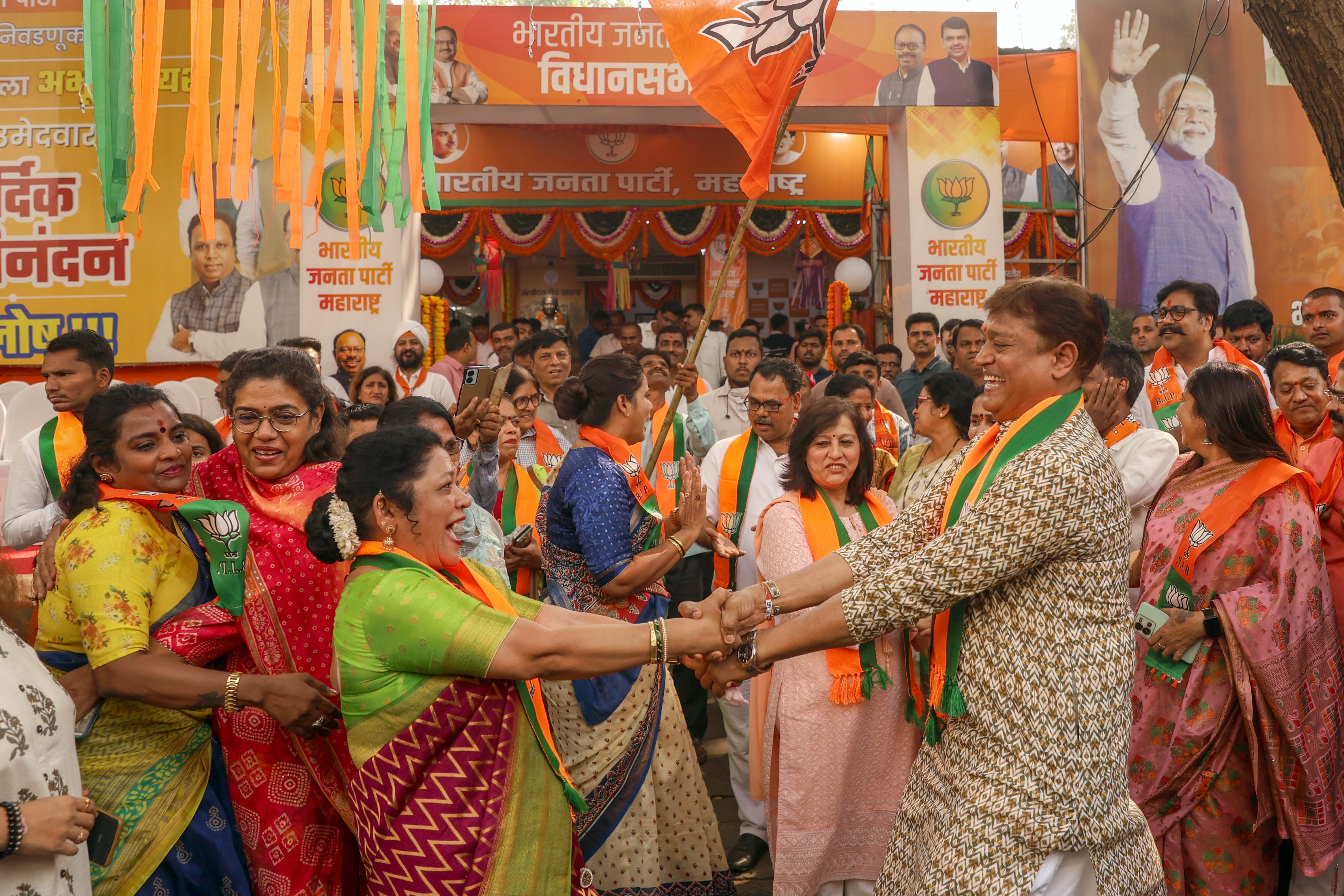 BJP supporters celebrate the election result in Maharashtra in Mumbai