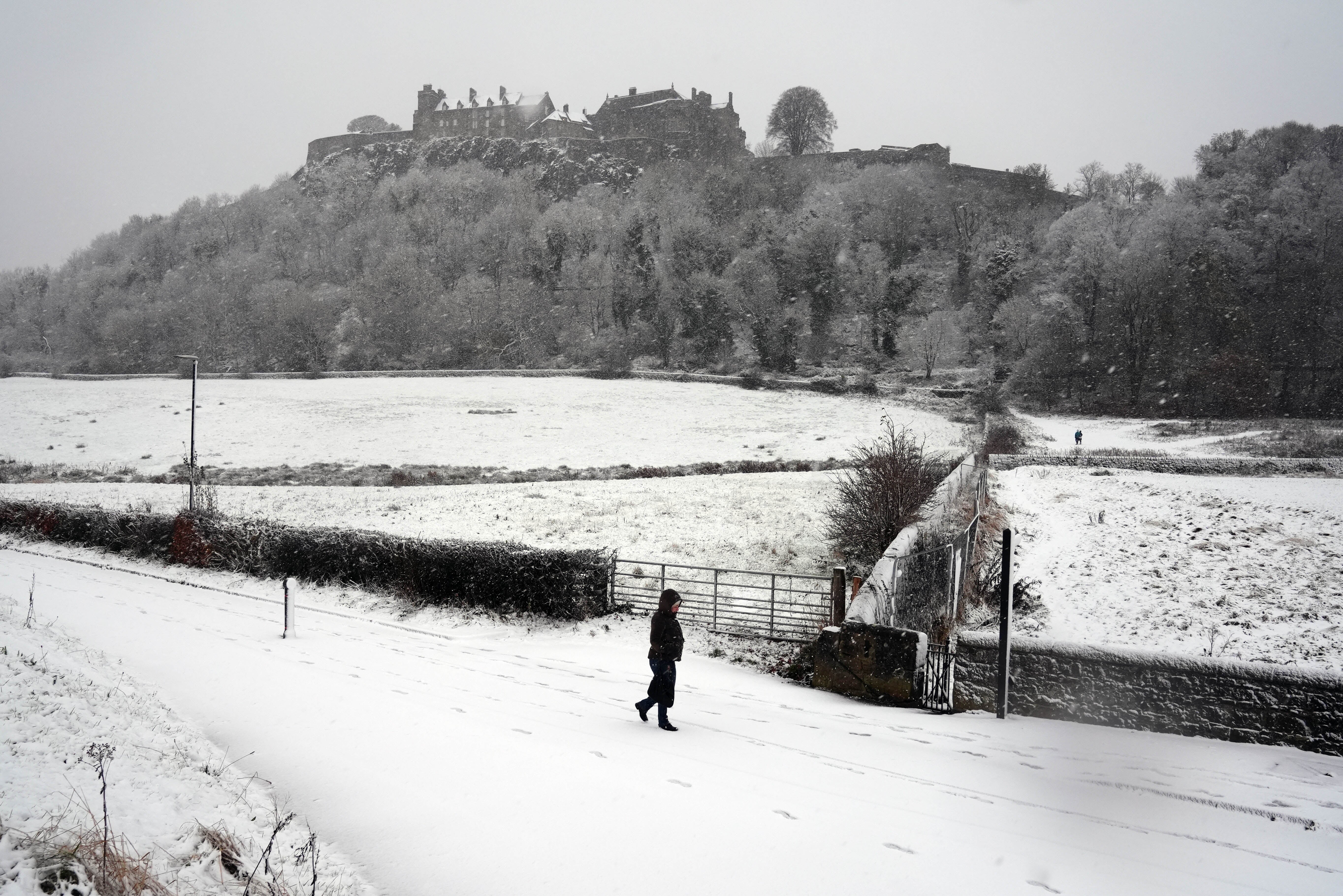 A person walks in the snow at Stirling Castle