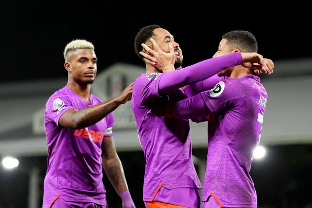 <p>Matheus Cunha (centre) netted a brace as Wolves saw off Fulham</p>