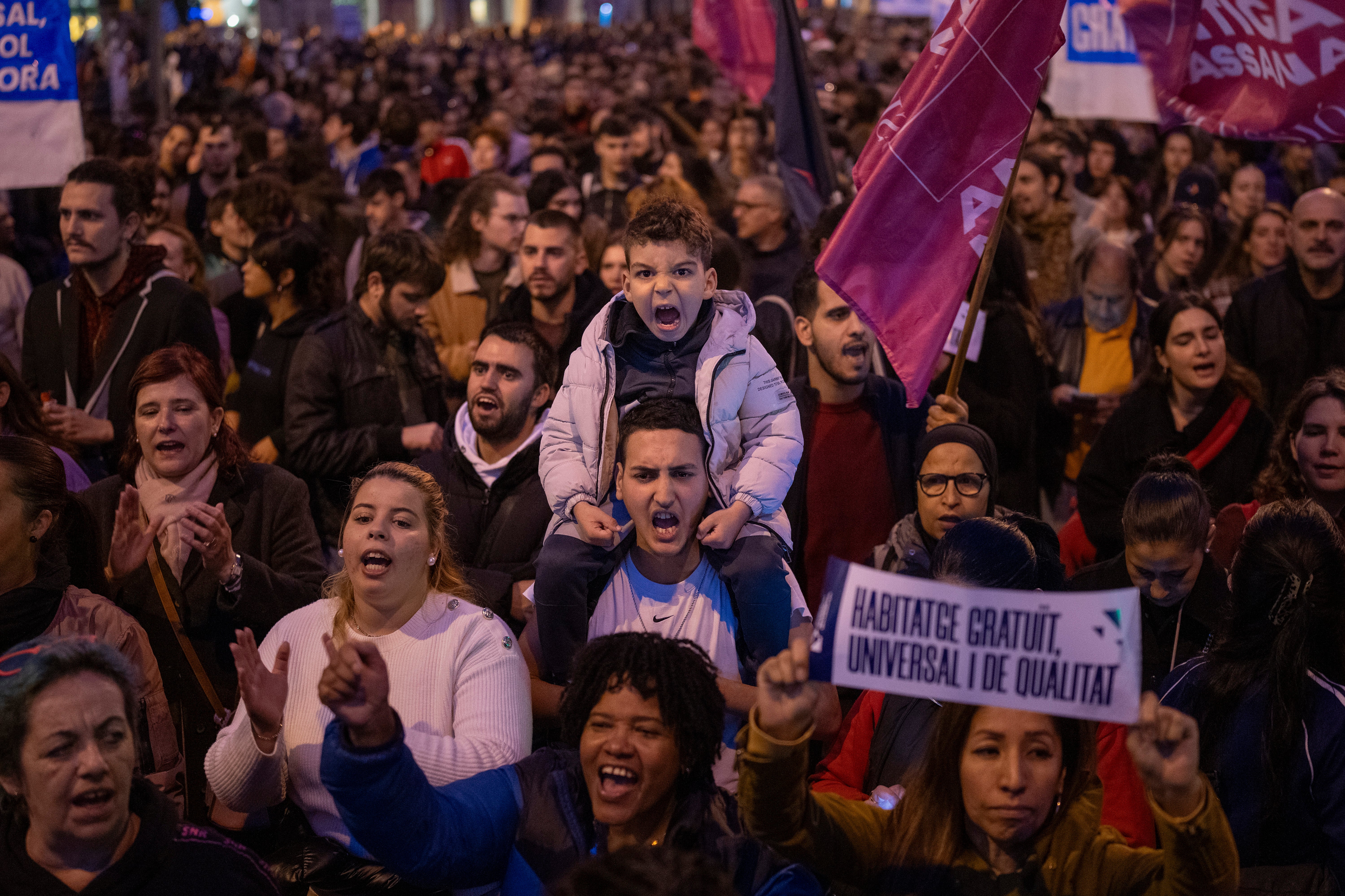 Demonstrators march to protest the skyrocketing cost of renting an apartment in Barcelona, Spain, Saturday, Nov. 23