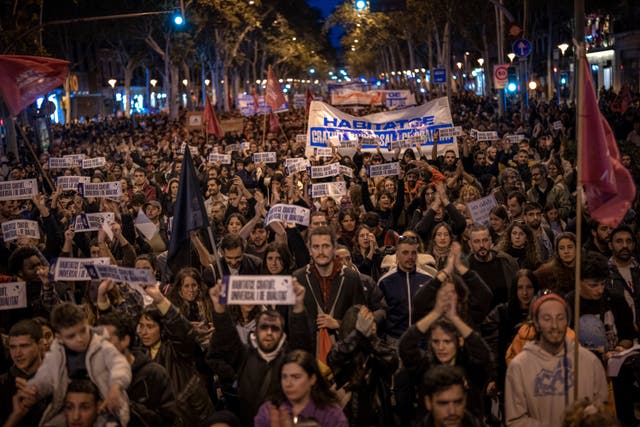 <p>Demonstrators march to protest the skyrocketing cost of renting an apartment in Barcelona</p>