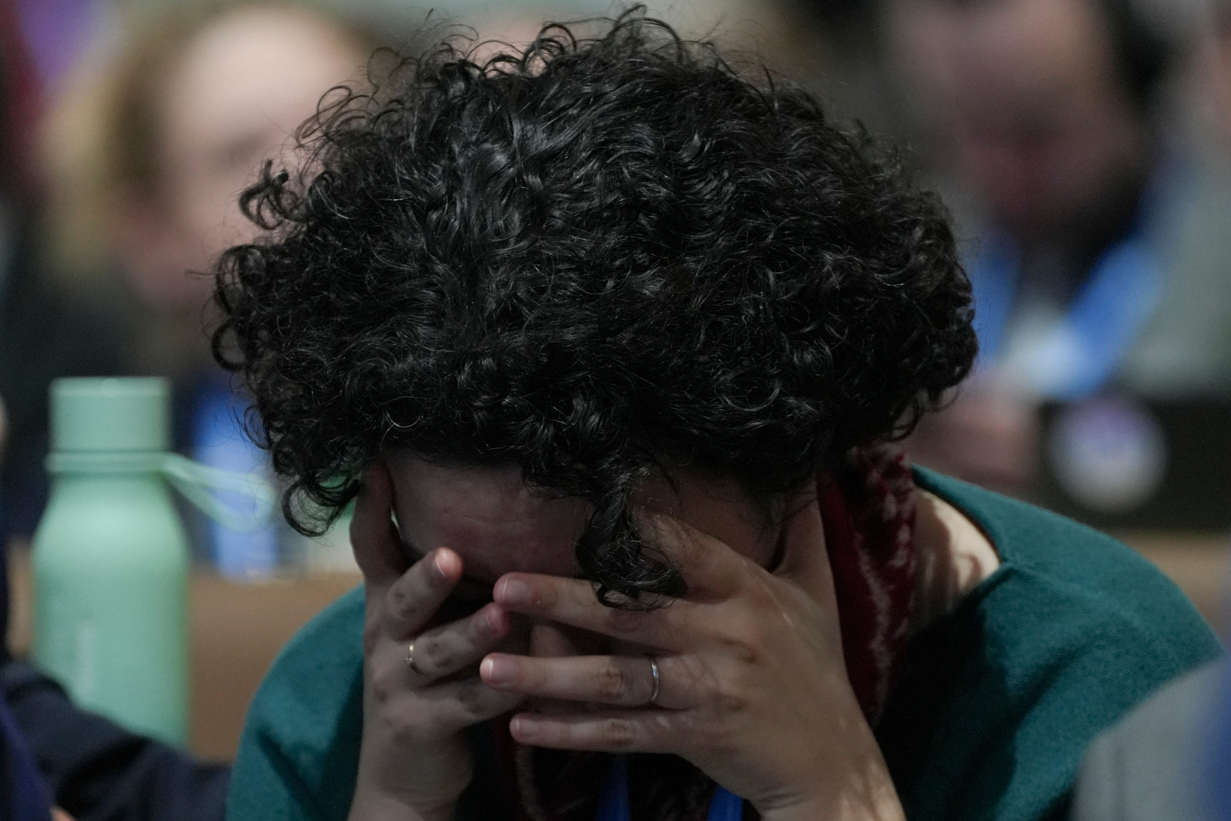 An attendee reacts during the closing plenary session at the Cop29 UN Climate Summit (Joshua A Bickel/AP)