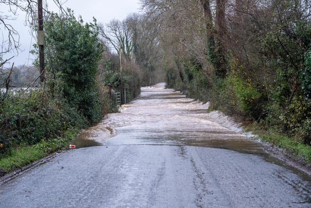 Flood alerts are in place across some parts of the UK as the country continues to be battered by Storm Bert (PA)