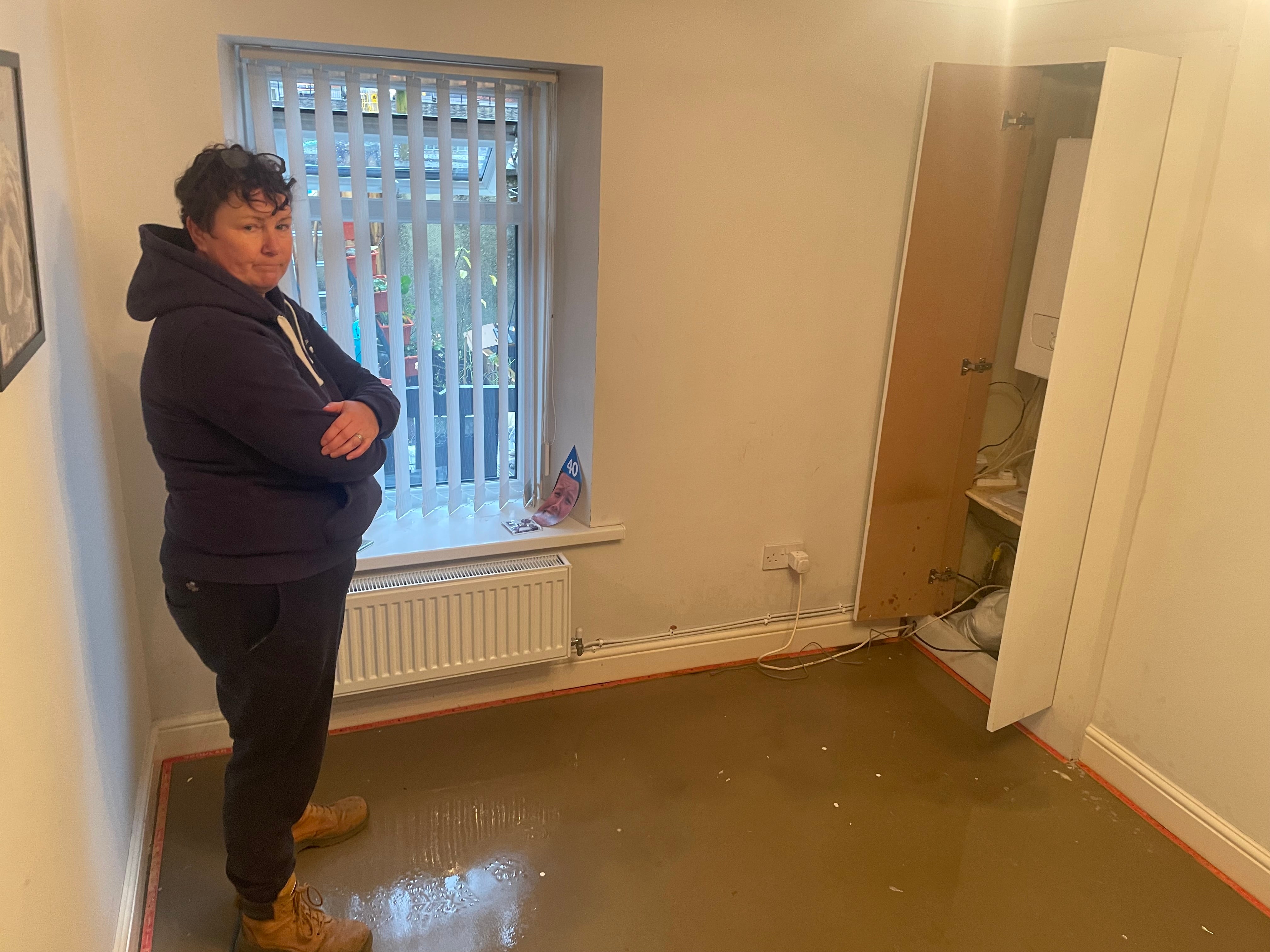 Paula Williams, inside her house Pontypridd, Wales which started flooding on Sunday morning