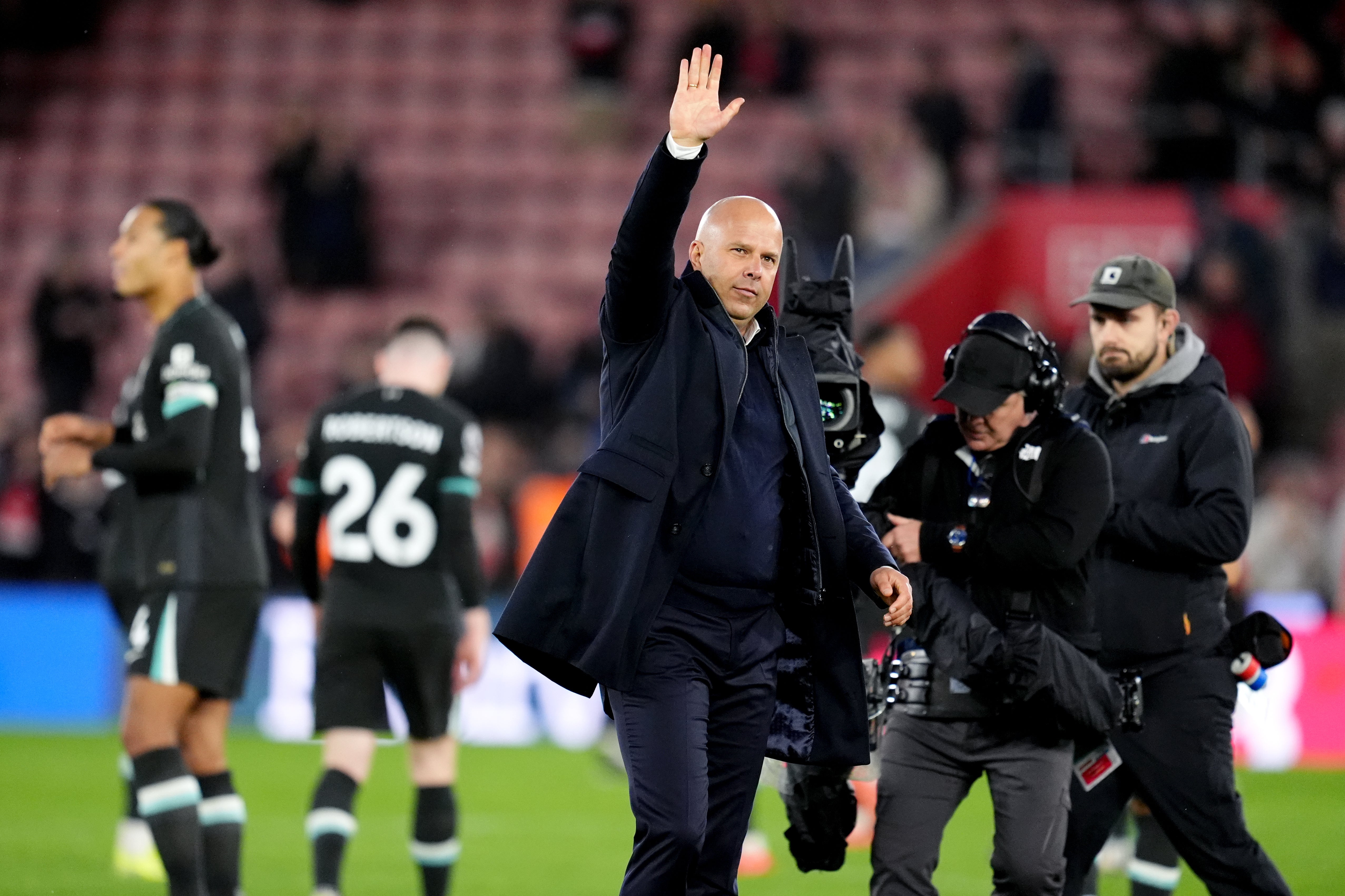 Arne Slot acknowledges fans at the end of the match