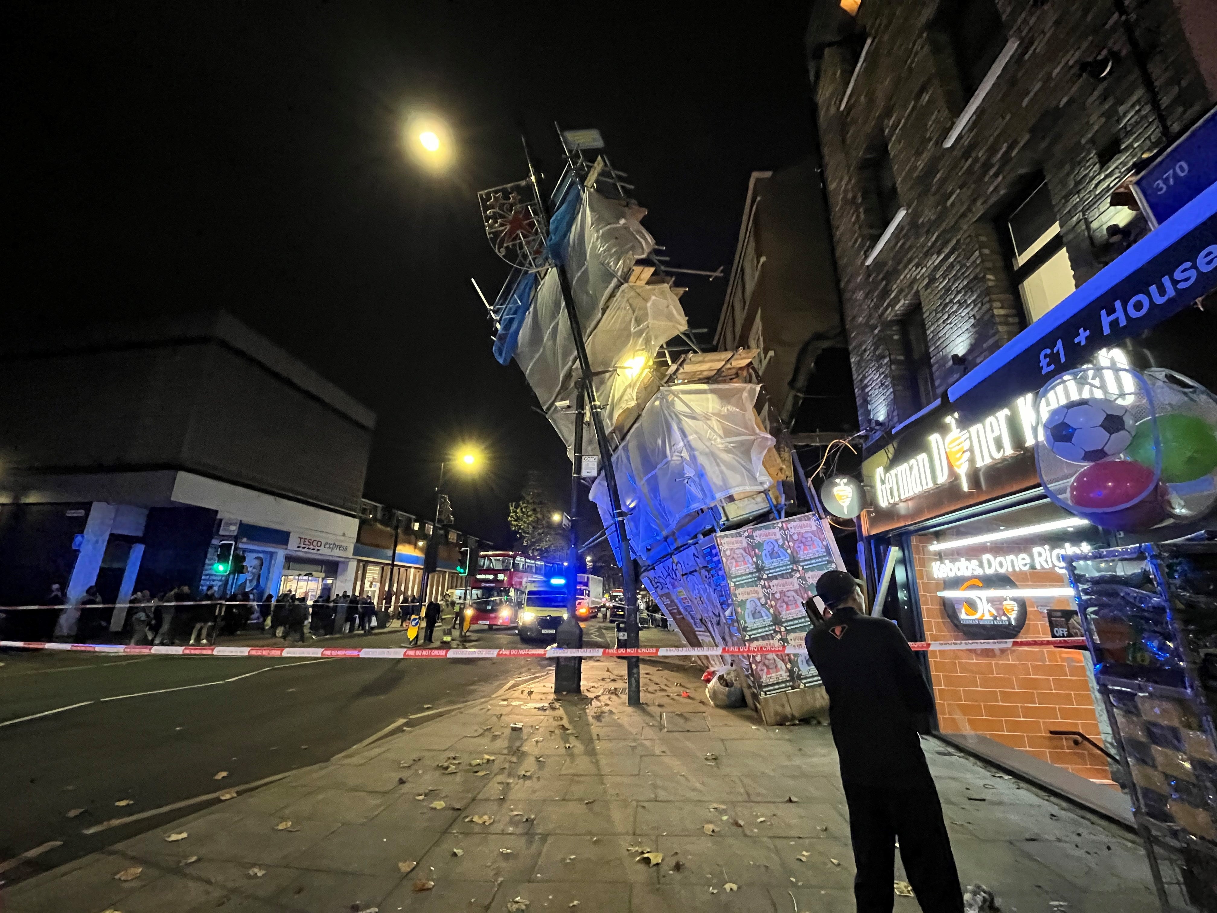 Emergency services are at the scene of a scaffolding collapse on Bethnal Green Road in London