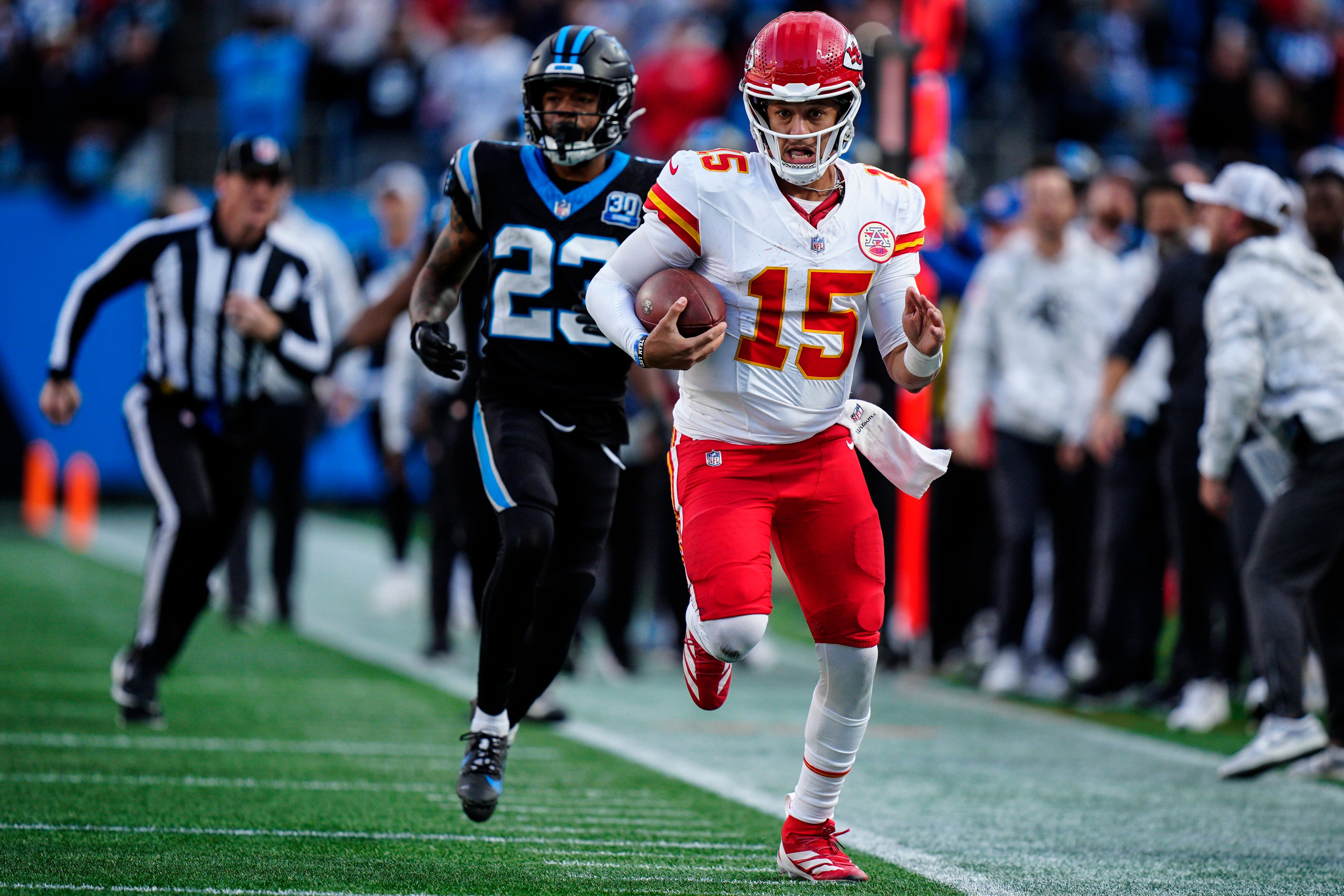 Kansas City Chiefs quarterback Patrick Mahomes (15) makes a key 33-yard run in overtime against the Carolina Panthers (Jacob Kupferman/AP)