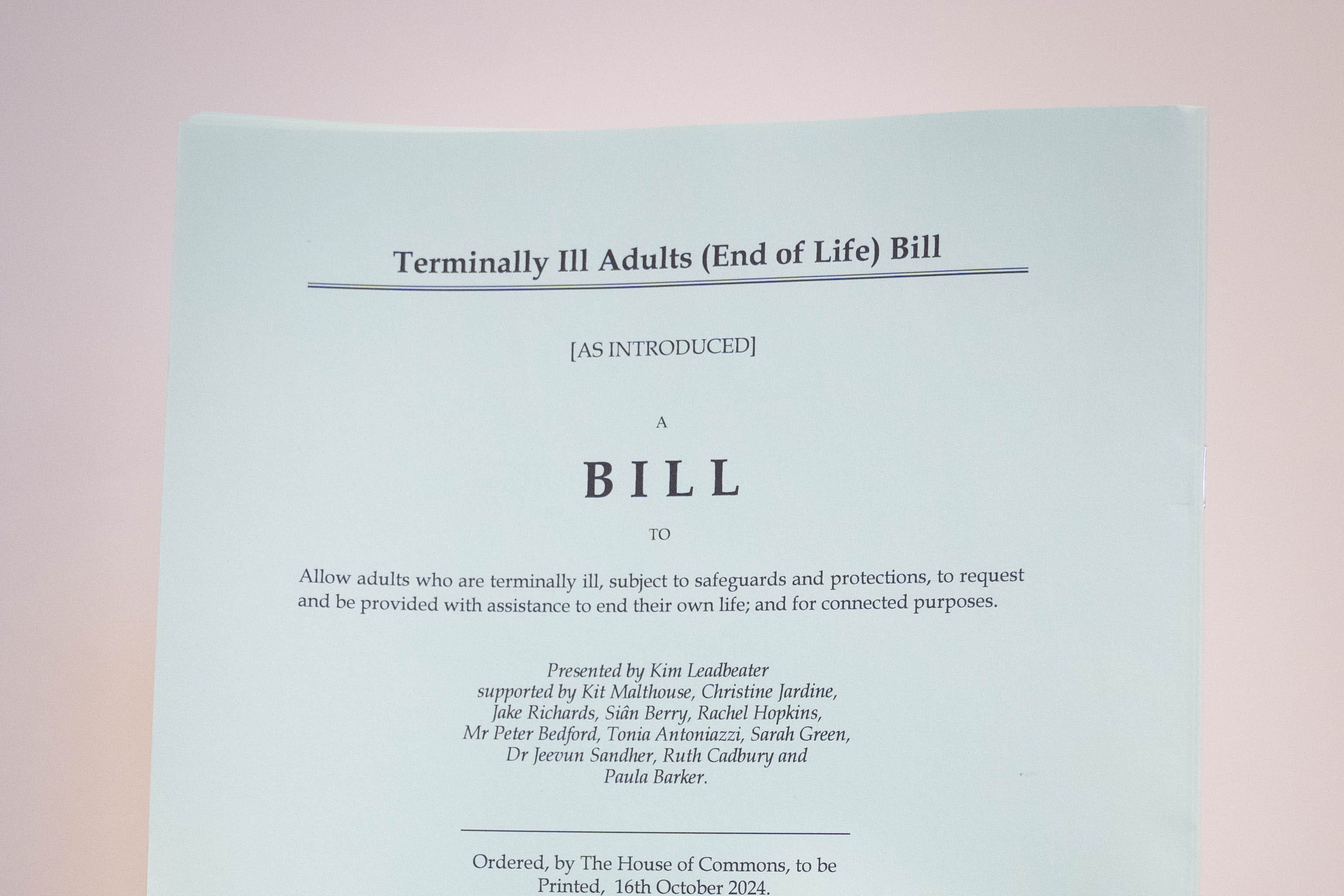 A person holding a hard copy of the Terminally Ill Adults (End of Life) Bill proposed by Labour MP Kim Leadbeater (PA)