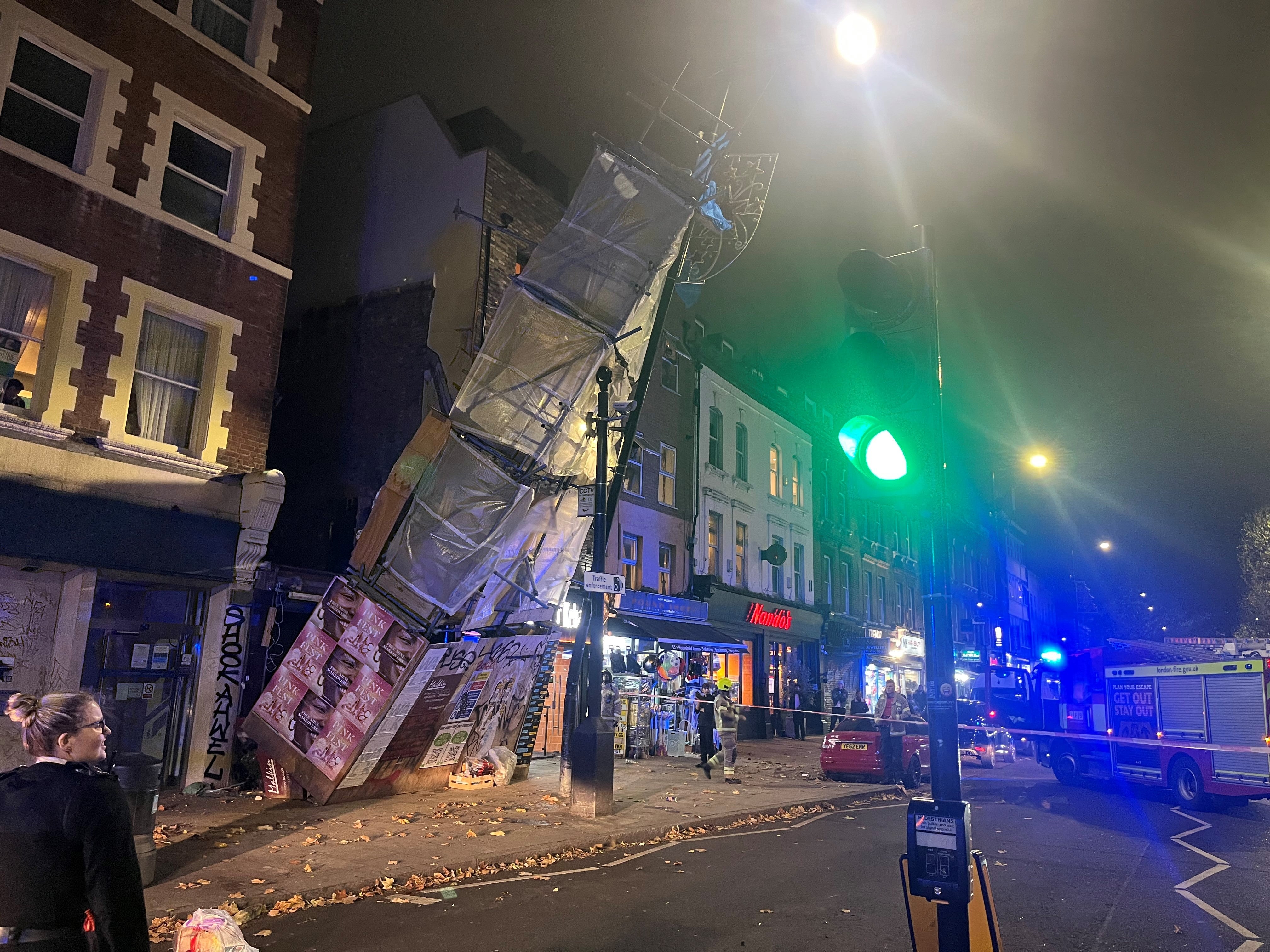 Emergency services at the scene of a scaffolding collapse on Bethnal Green Road, London