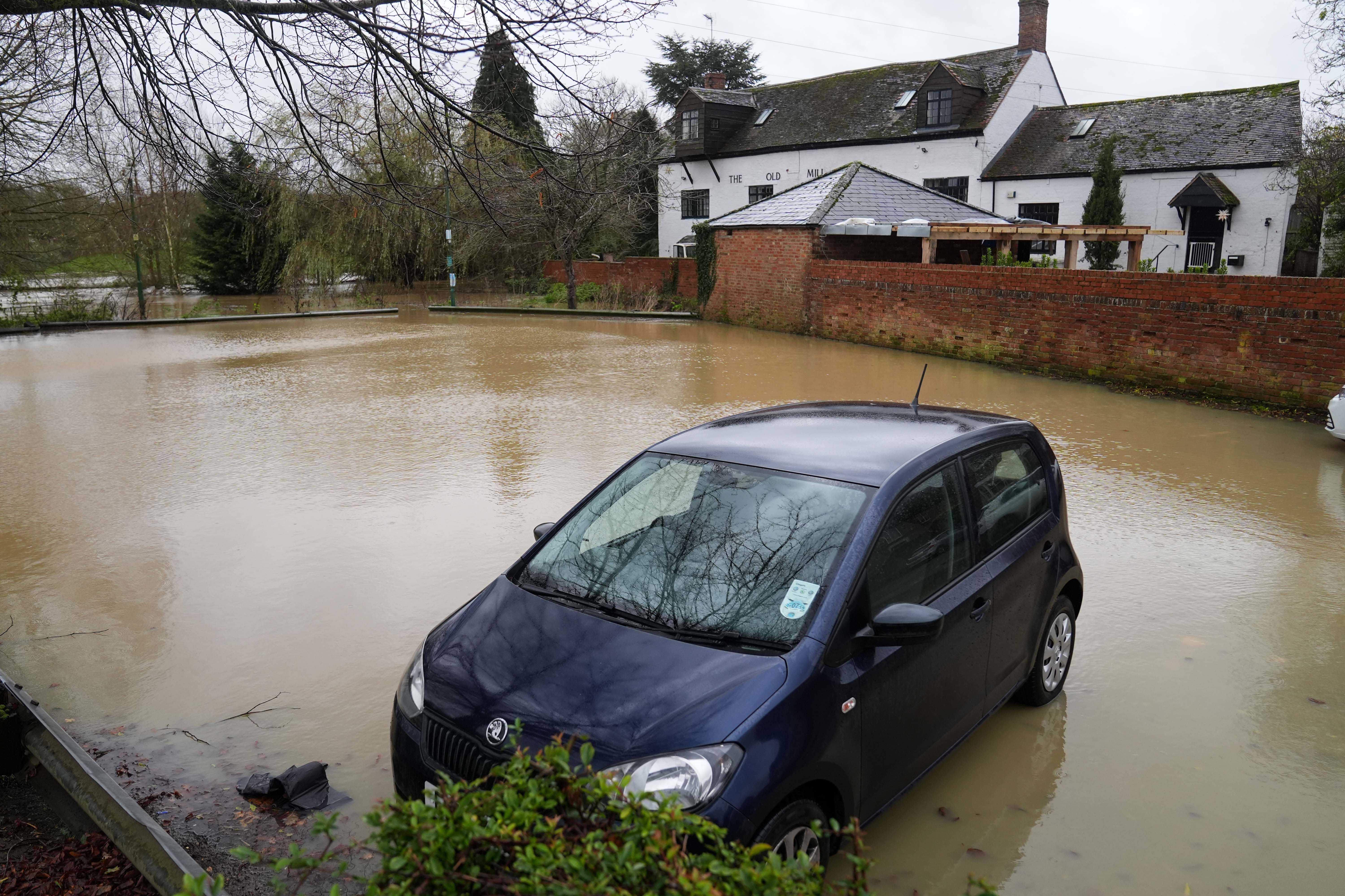 Flooding spilled into a car park in Warwickshire (Jacob King/PA)