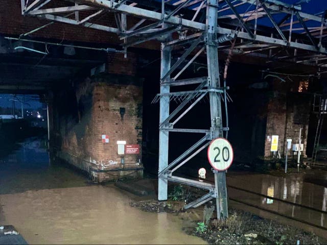 <p>Off limits: The flooded railway line at Northampton</p>