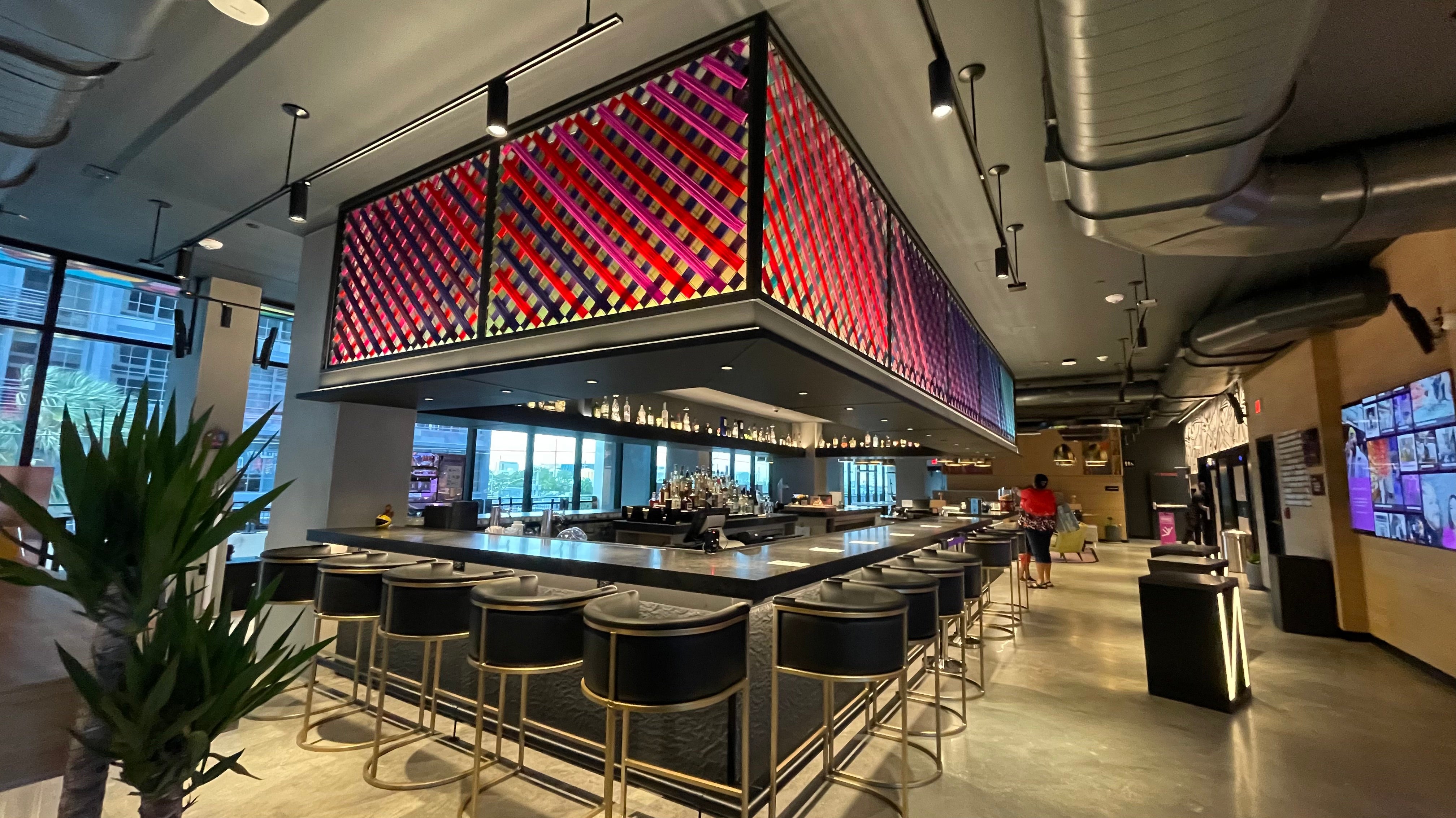 The bar, which doubles as the reception desk, at the Moxy Miami Wynwood hotel