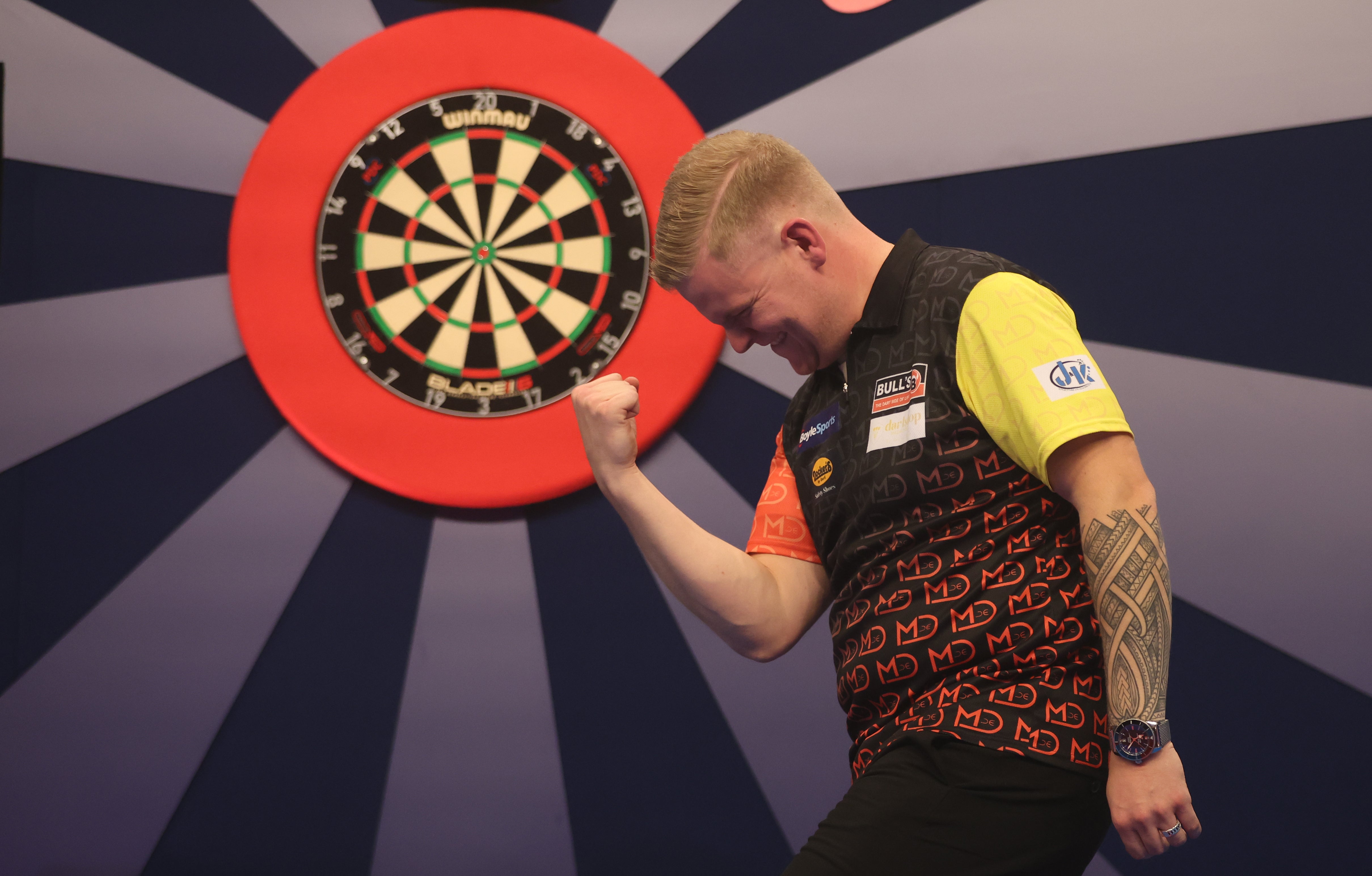 Mike De Decker celebrates after winning the World Grand Prix darts final