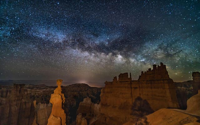 <p>The Milky Way low in the sky over Thor’s Hammer below Sunset Point in Bryce Canyon National Park, Utah (Alamy/PA)</p>
