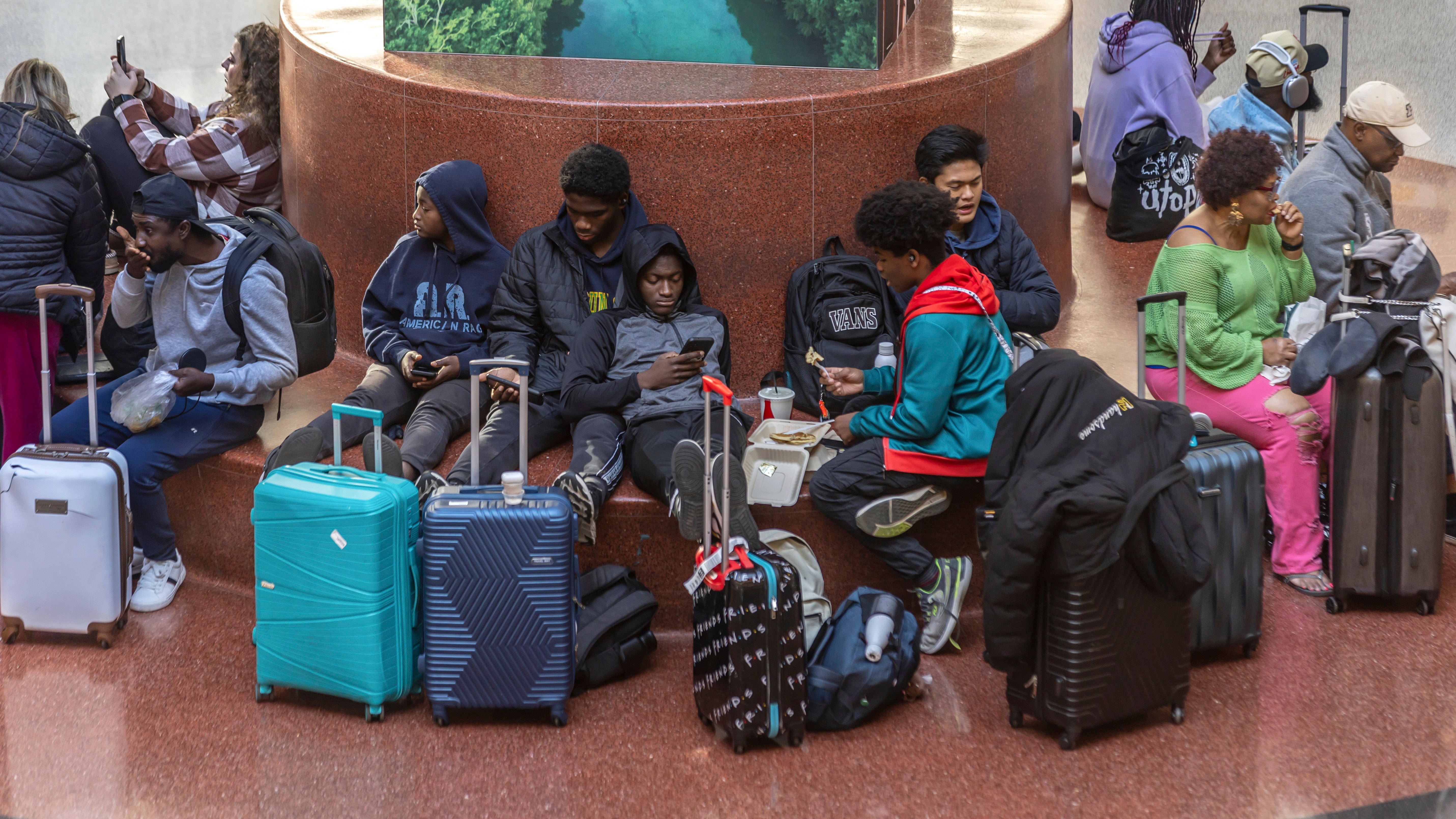 Travelers wait at Hartsfield-Jackson International Airport in Atlanta on November 22 as the Thanksgiving travel season kicks off