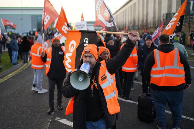 <p>GMB union members picket outside the Amazon fulfilment centre in Coventry last year</p>