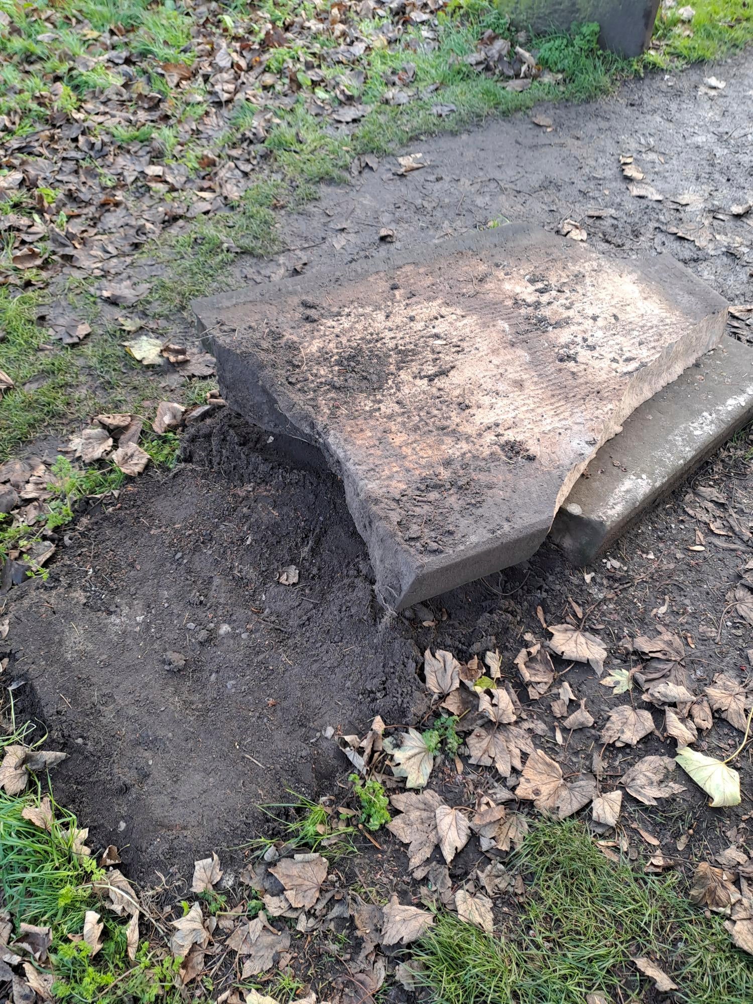 In this picture, provided by the West Mercia Police on Monday, Nov. 25, 2024, a smashed movie prop tombstone that was used for the "A Christmas Carol" movie is seen in Shrewsbury, England