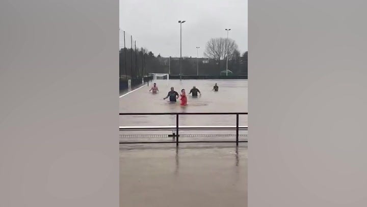 <p>Footballers turn flooded Gloucestershire pitch into swimming pool.</p>