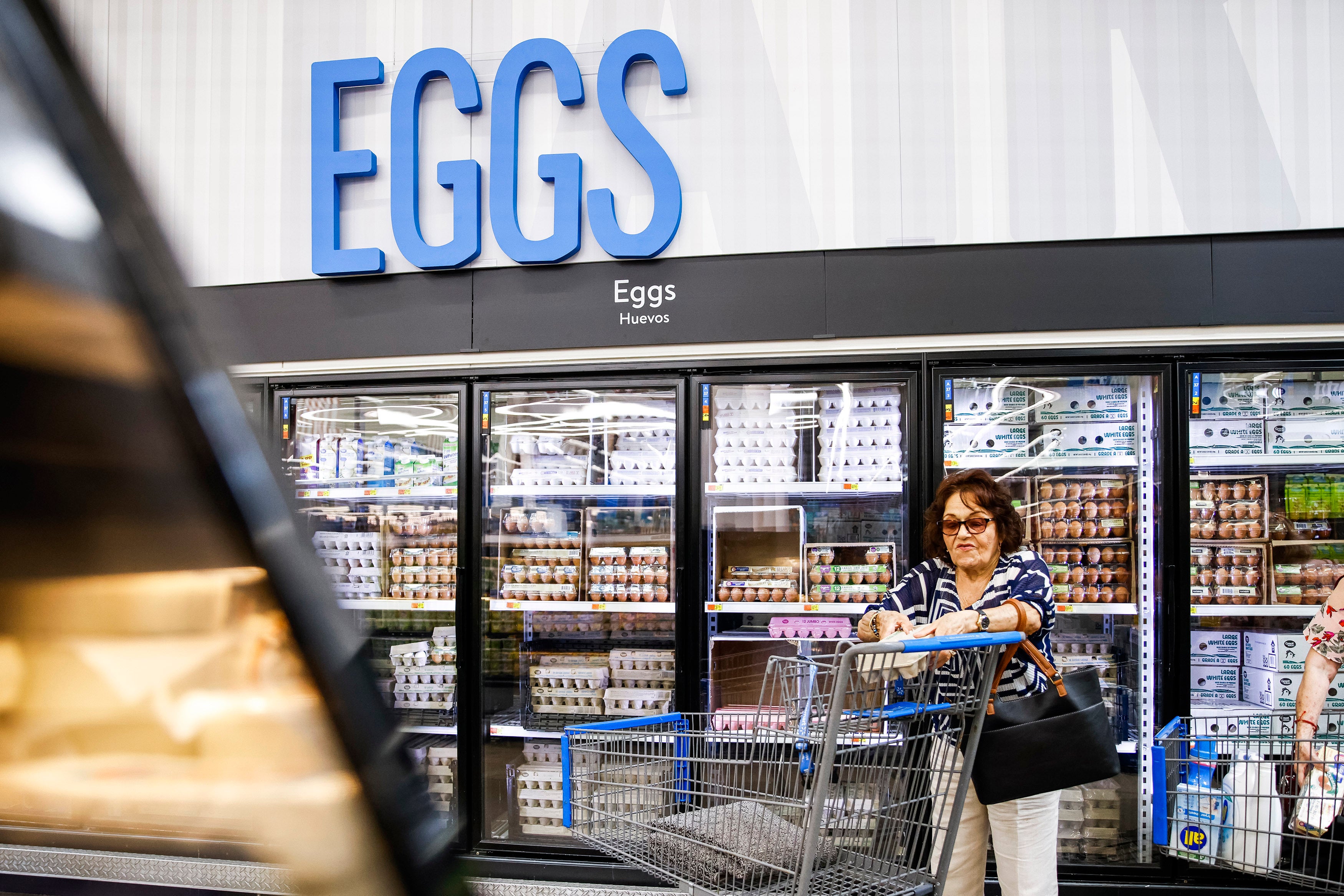 A woman buys eggs at a Walmart Superstore in Secaucus, New Jersey, on July 11, 2024