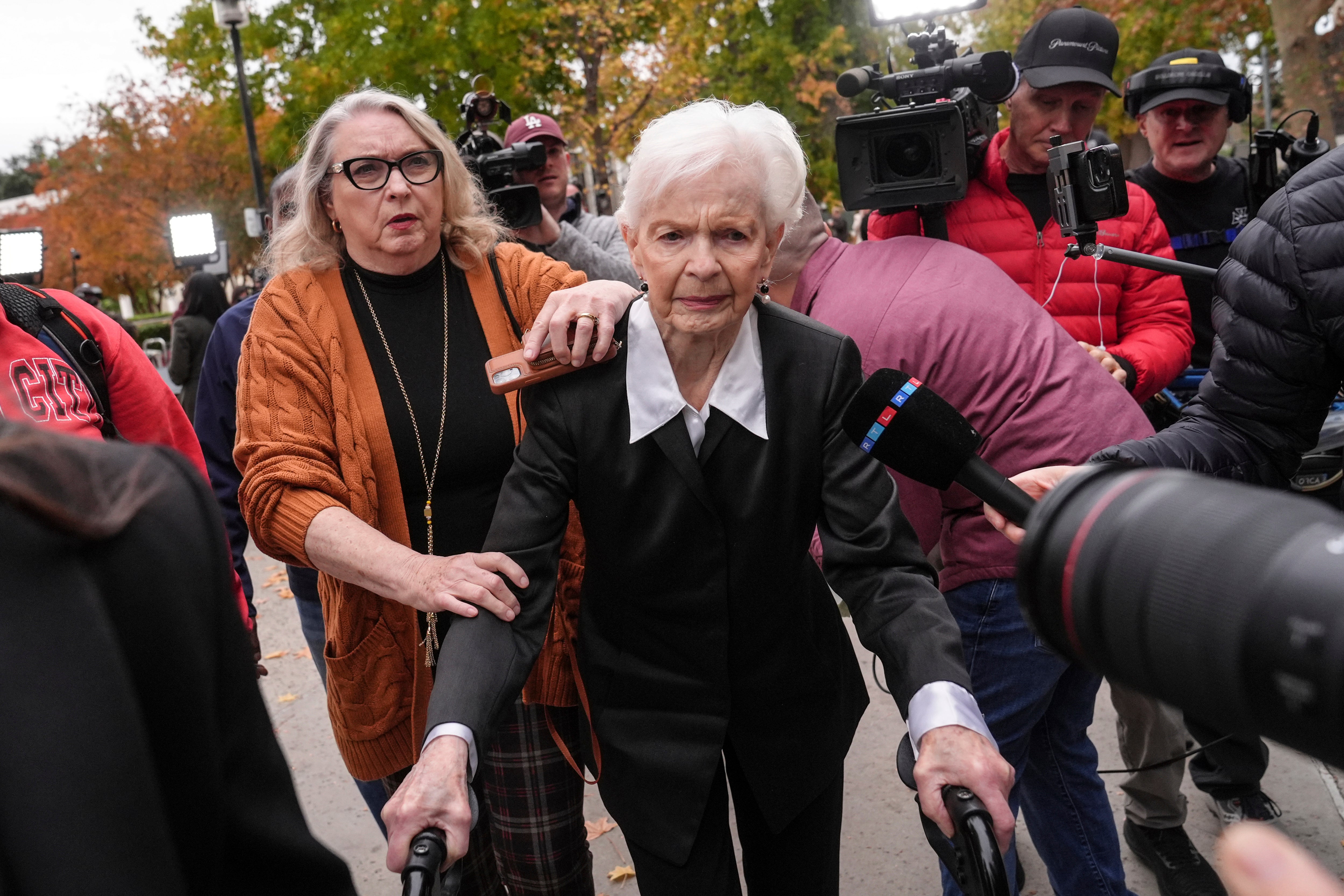 Erik and Lyle Menendez's aunt Joan VanderMolen, center, arrives at a courthouse