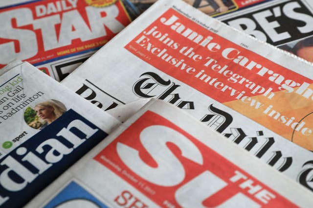 A collection of British newspapers.