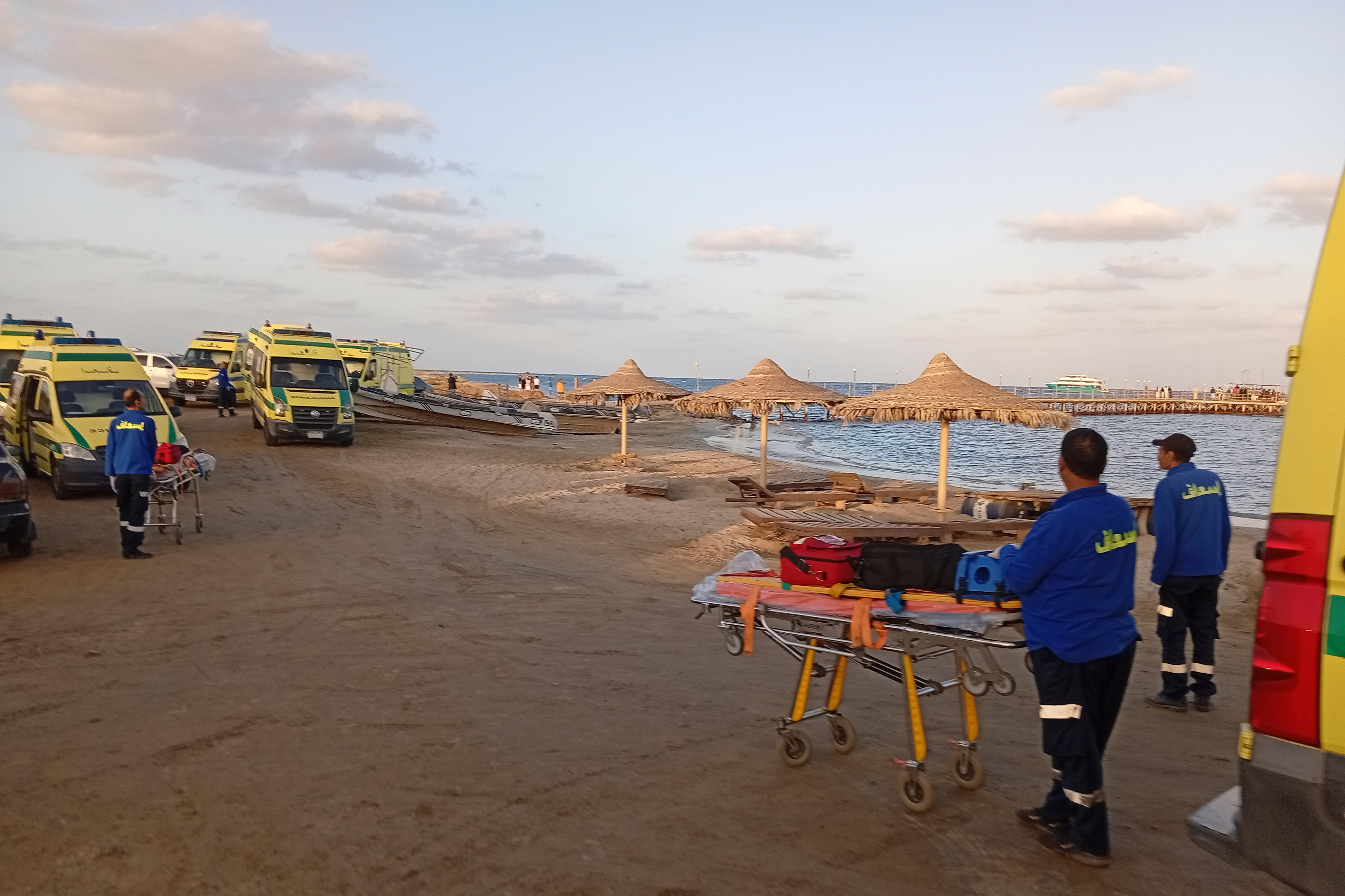 Rescuers wait on the beach of Marsa Alam, Egypt on Monday, 25 November 2024 after a tourist yacht sank in the Red Sea