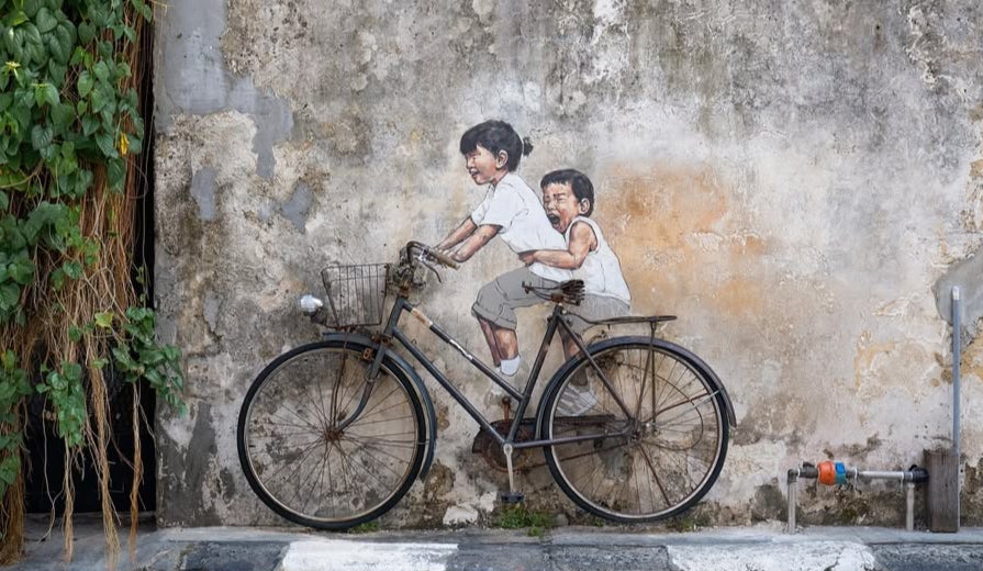 Children On A Bicycle by Ernest Zacharevic