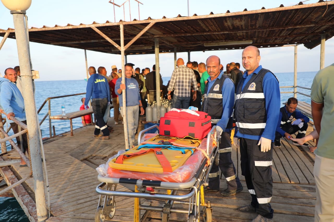 Medics prepare a stretcher as they await possible survivors