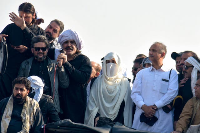 <p>Bushra Bibi, centre, wife of imprisoned former premier Imran Khan and leaders of Khan's party lead their supporters during a rally demanding Khan's release</p>