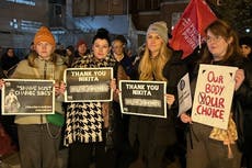 Nikita Hand supporters march through Dublin after Conor McGregor case verdict