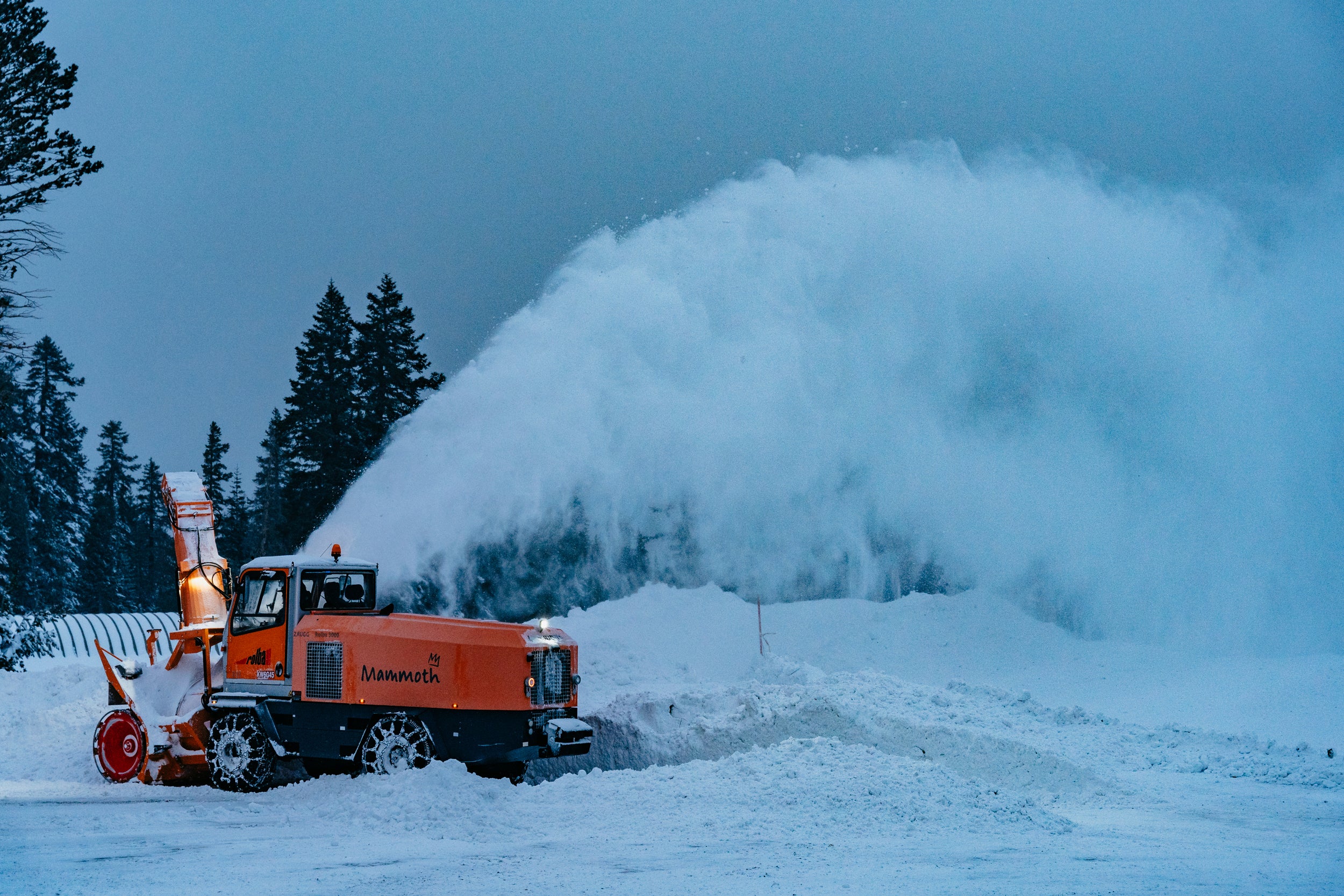 Snow is cleared as it piles up during a storm on Sunday in Mammoth Lakes, California. California’s higher elevations will see even more snow after a historic storm last week