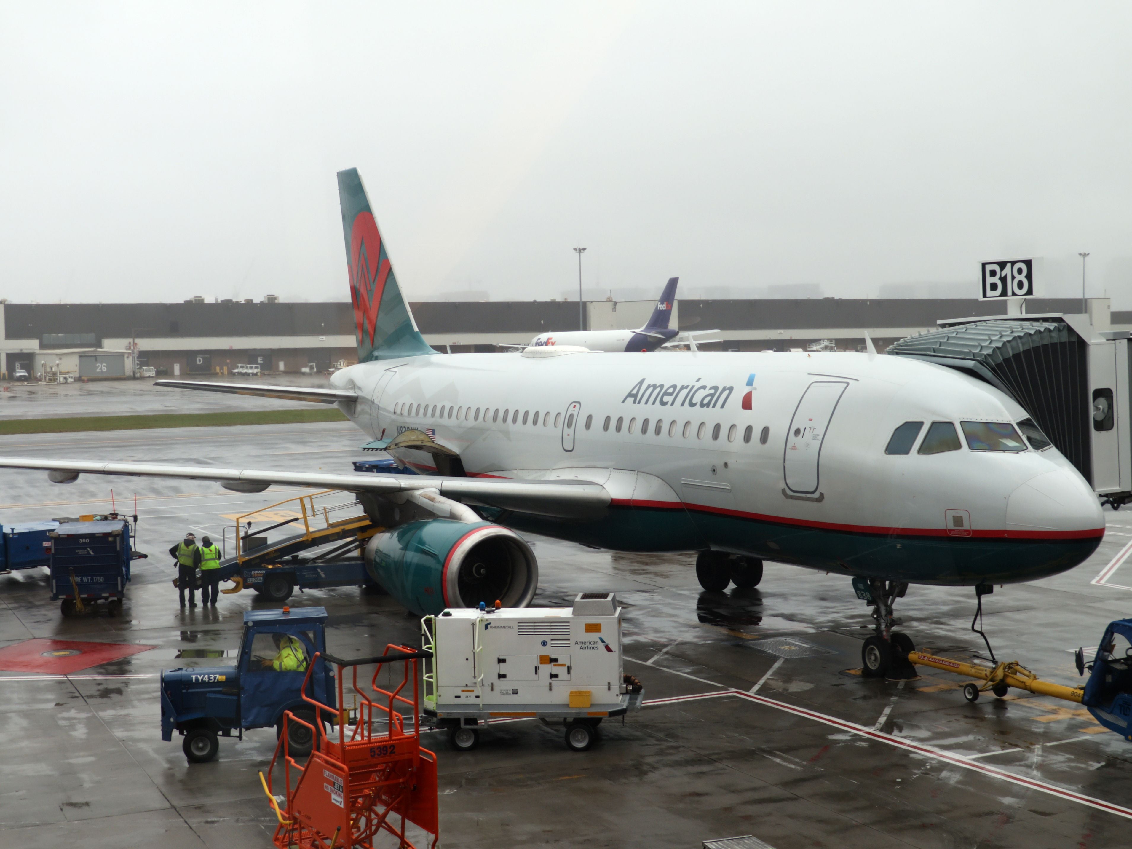 An American Airlines plane sits at the gate at Boston Logan International Airport