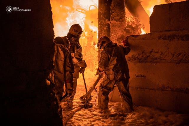 <p>Rescuers work at the site of a Russian drone strike in Ternopil</p>