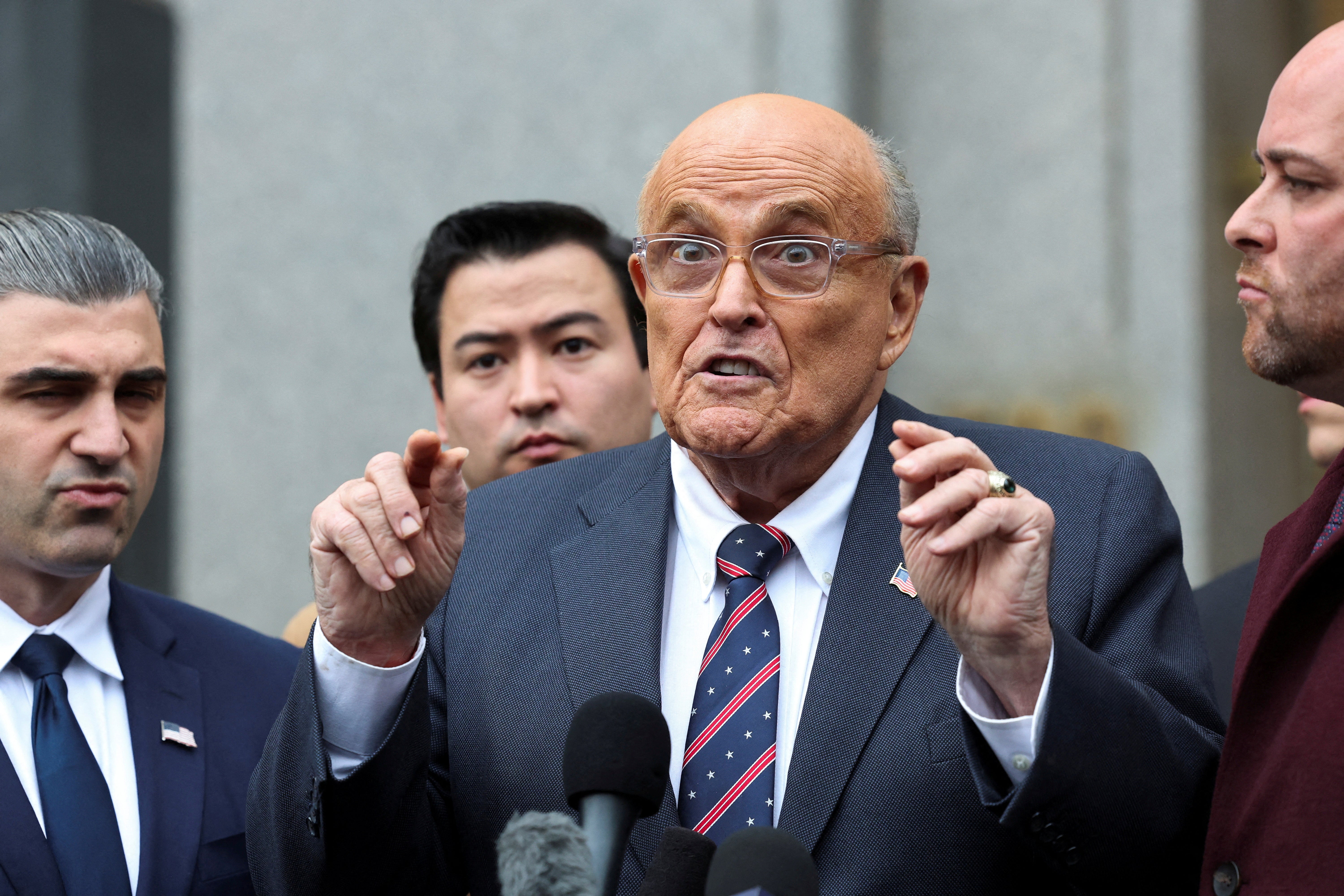 Speaking outside a federal courthouse in Manhattan on Tuesday, Giuliani claims he is being ‘punished’