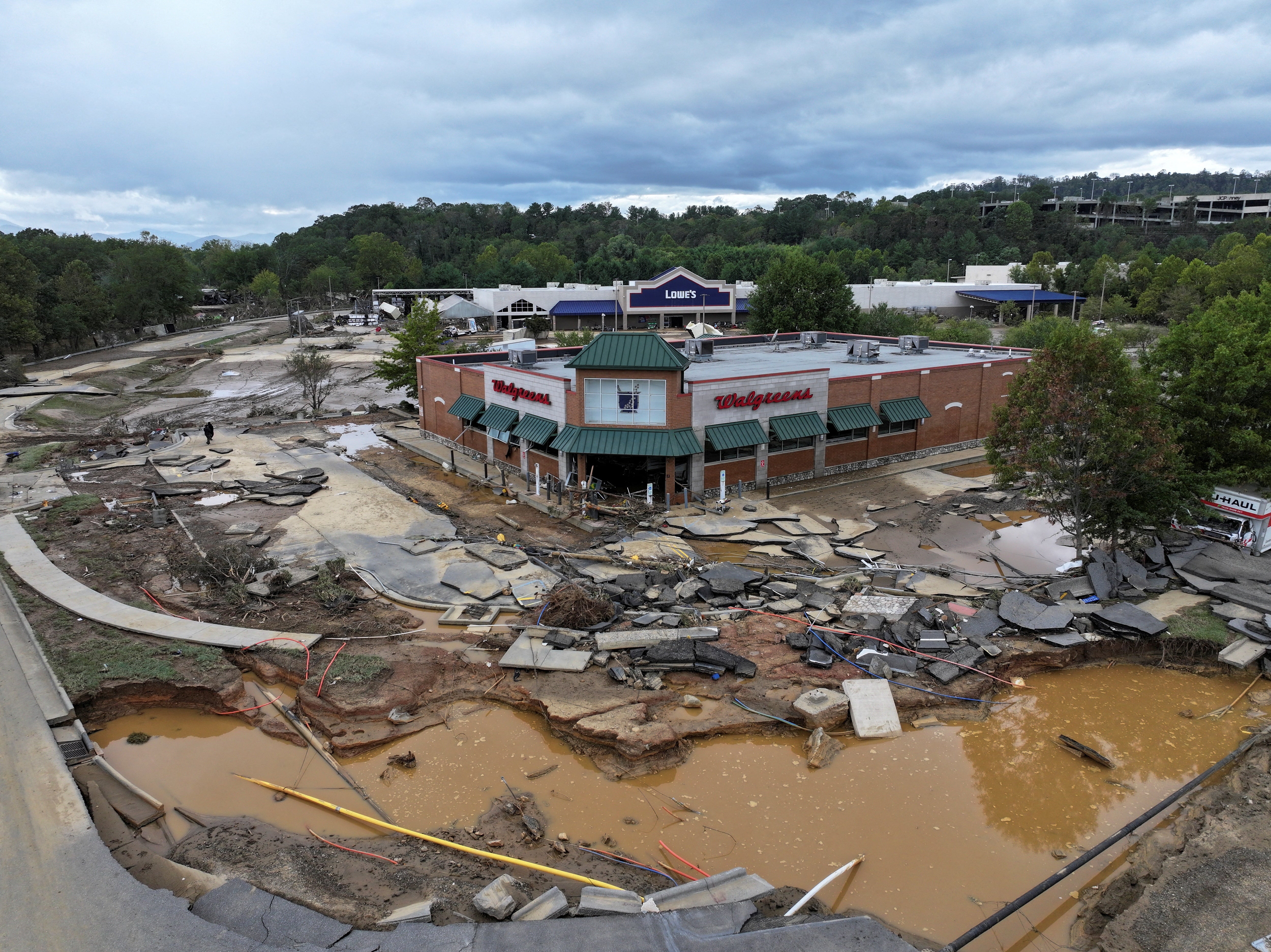 A damaged area is seen in Asheville, North Carolina, after the passing of Hurricane Helene late last September. Experts say hurricanes this year in the U.S. have caused around $500 billion in damage and economic losses