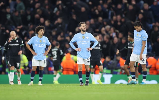 <p>Manchester City’s players react after Feyenoord’s leveller</p>