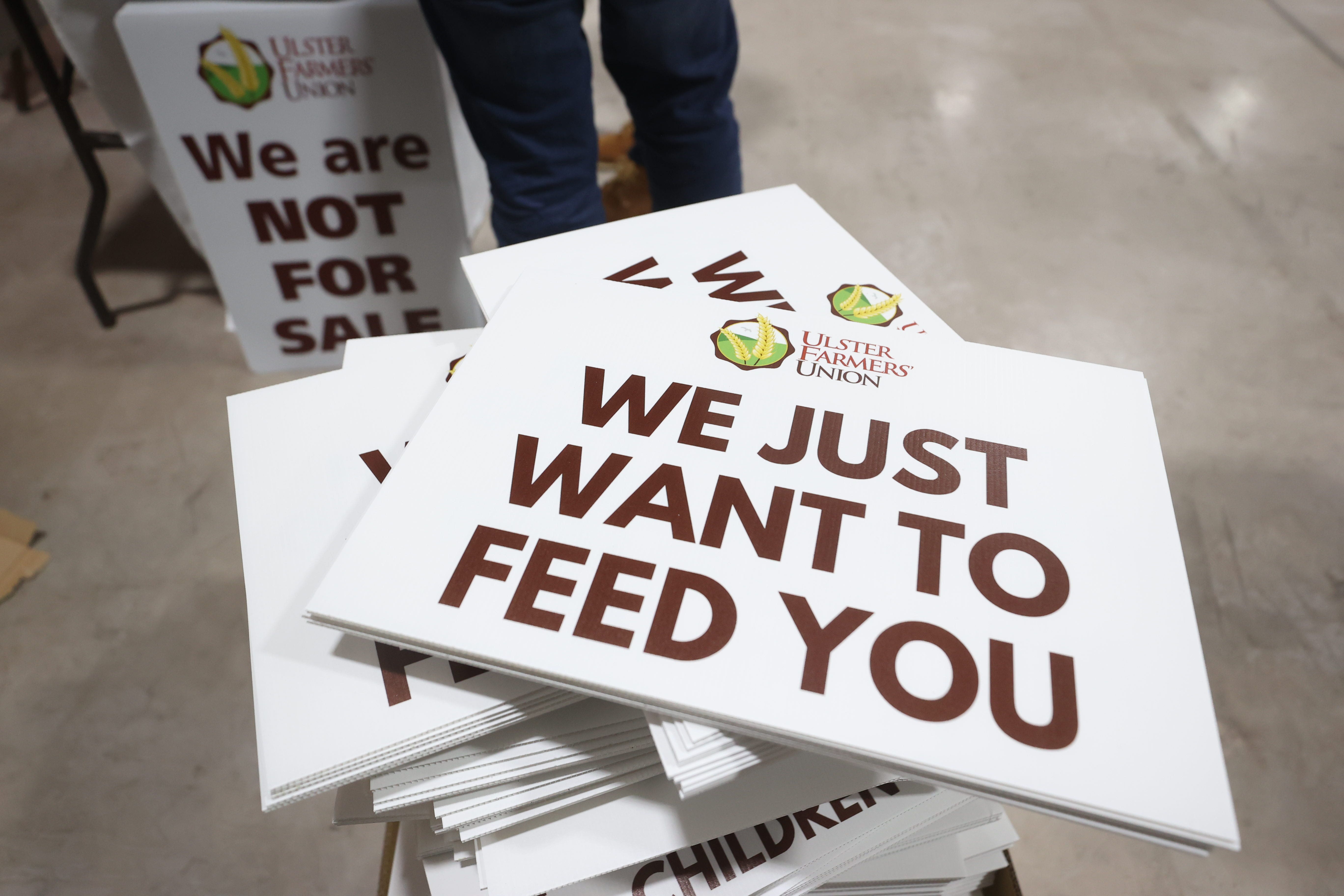 Protest banners at the Ulster Farmers’ Union rally at the Eikon Exhibition Centre, Lisburn, Co Antrim (Liam McBurney/PA)