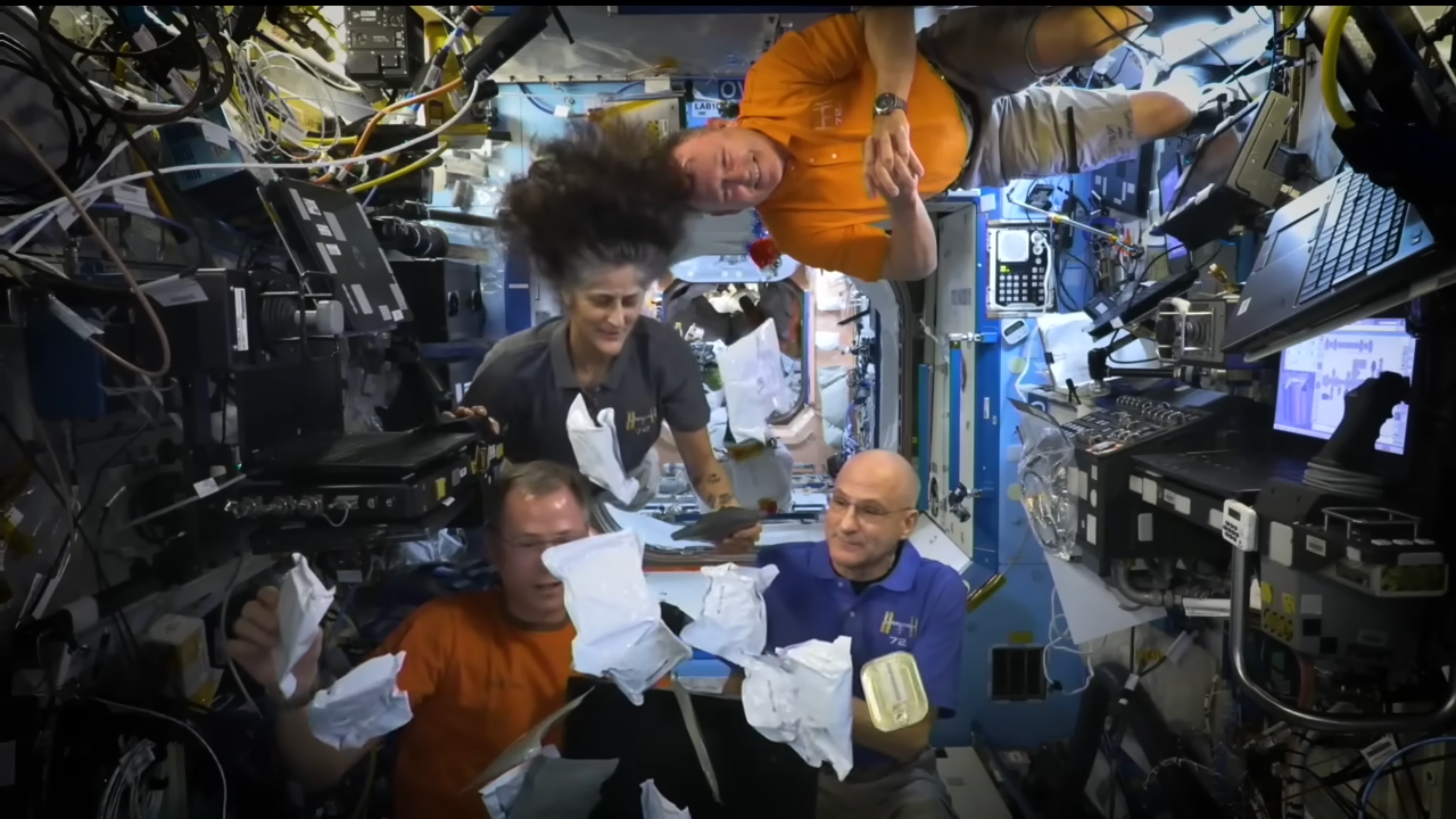 Bits of the Expedition 72 crew’s Thanksgiving meal flies around the International Space Station on Tuesday. Despite the challenges, astronauts said they were thankful for the weightlessness of space. “It’s fantastic,” said Butch Wilmore.