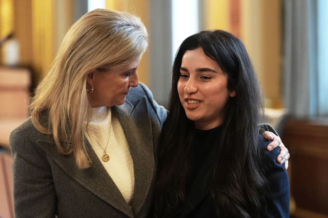 The Duchess of Edinburgh speaking to Yazidi survivor Awaz Abdi during her visit to view The Women Who Beat ISIS travelling photo exhibition (Aaron Chown/PA)