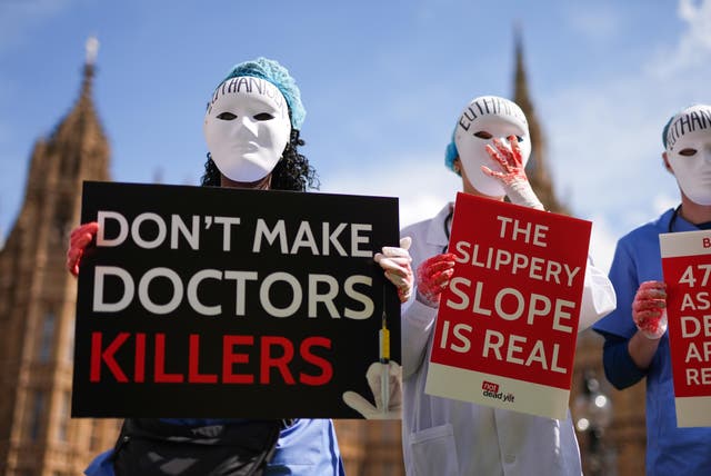 <p>Campaigners protest outside Parliament ahead of a debate in the House of Commons on assisted dying (Jordan Pettitt/PA)</p>