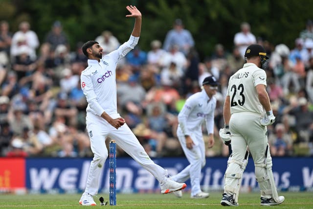 England’s Shoaib Bashir bowls during play on the first day of the first Test between England and New Zealand at Hagley Oval in Christchurch (Andrew Cornaga/Photosport/AP)