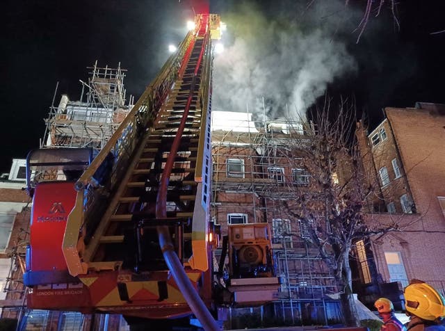 Five people in hospital after fire breaks out at takeaway and flats ...