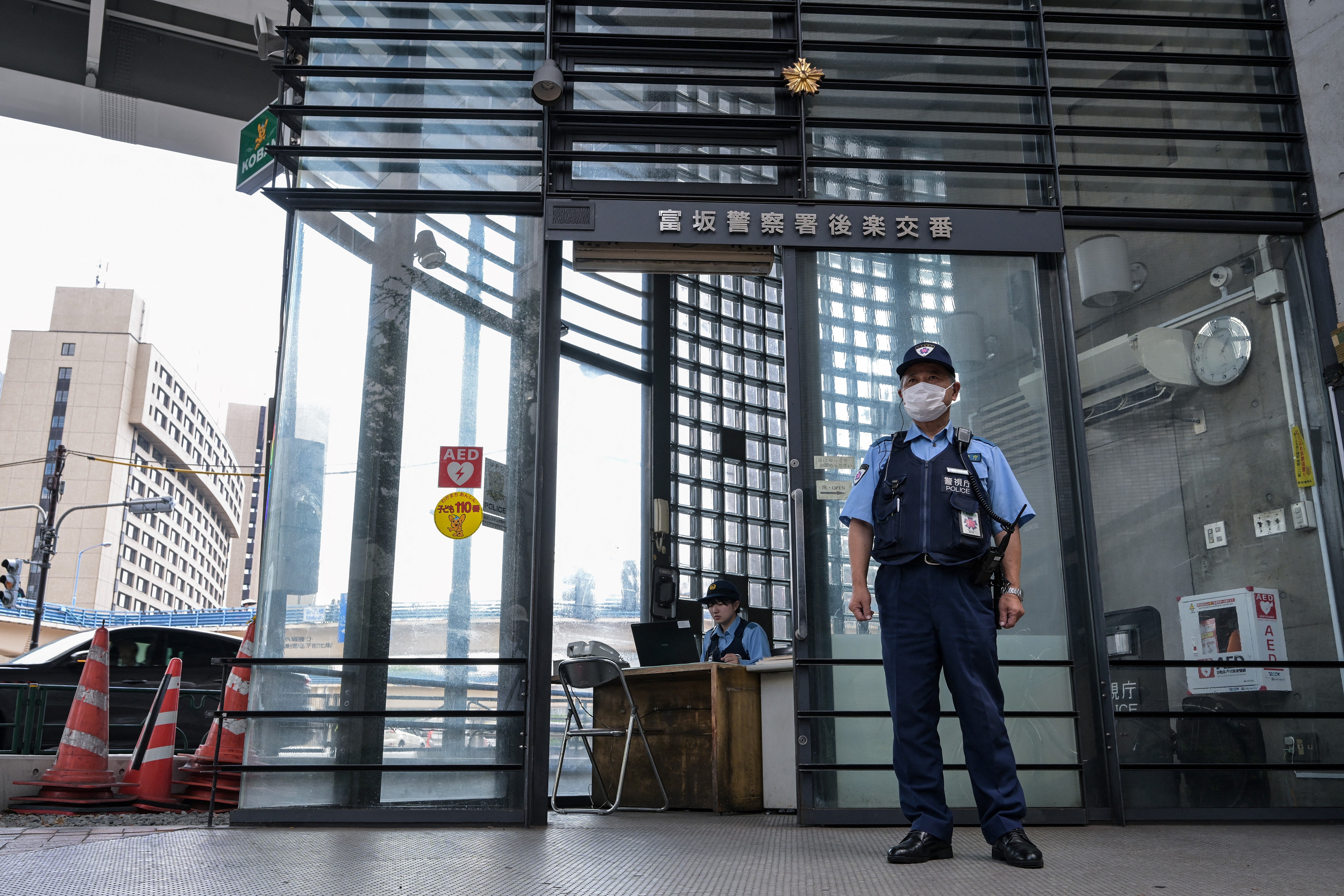<p>File: Police officer standing outside a police box in Tokyo</p>