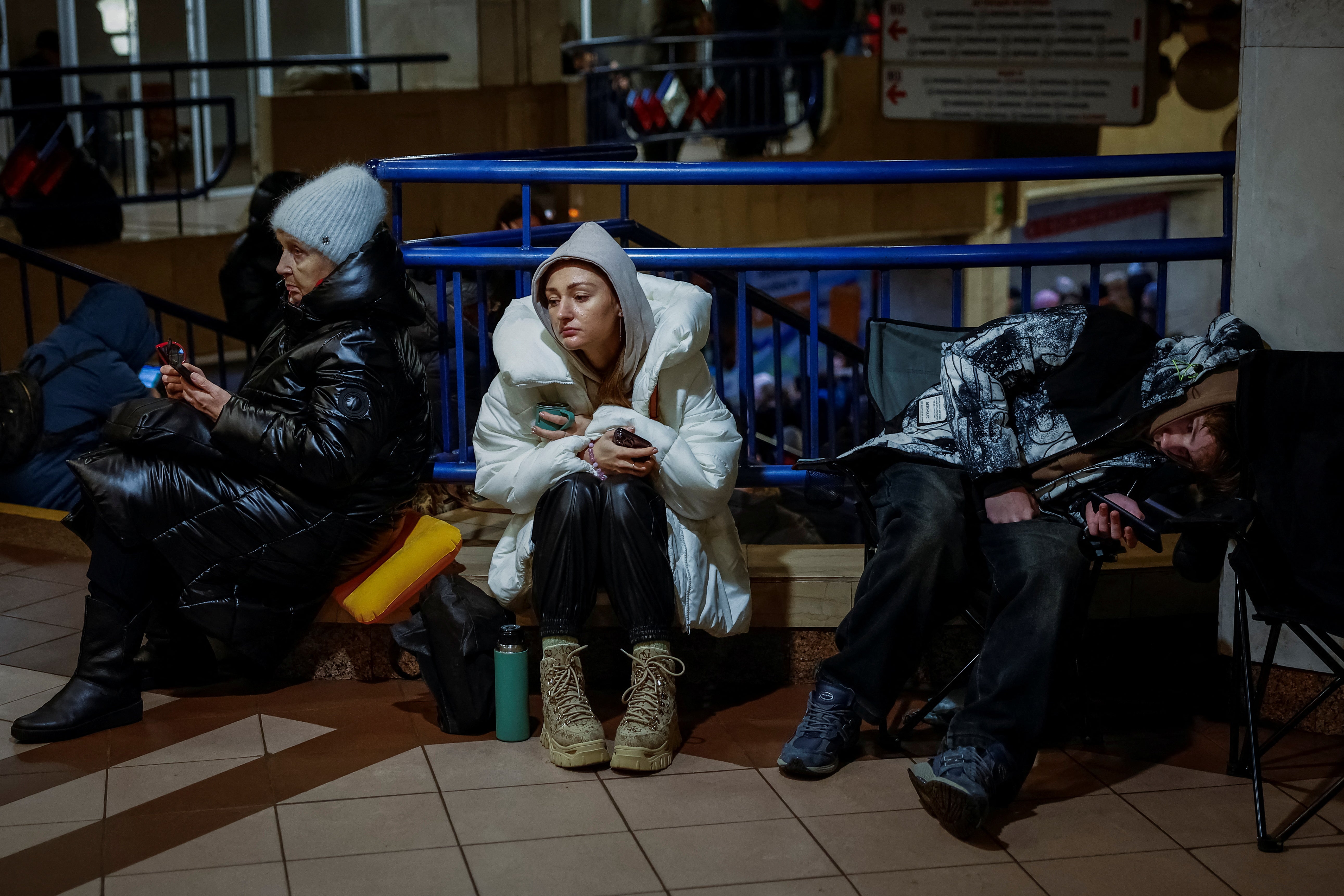 People take shelter inside a metro station during a Russian military strike in Kyiv on Thursday